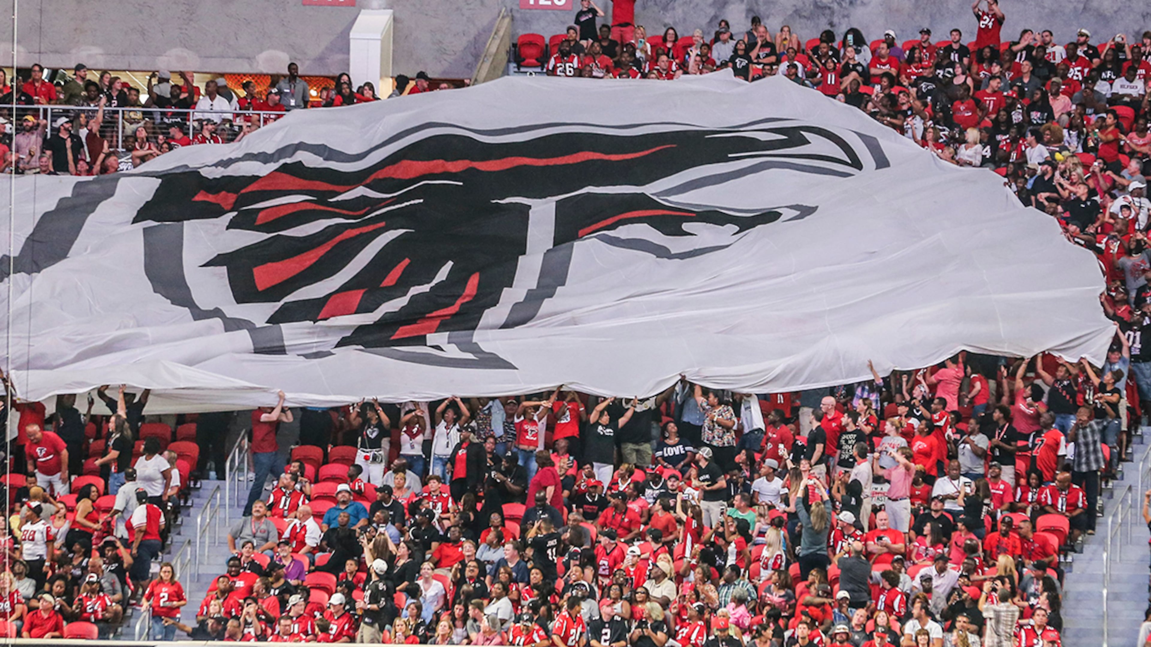 Passing the flag on Saturday, Aug. 26, 2017 at the opening of the brand new Mercedes Benz Stadium and pre-season NFL game between the Atlanta Falcons and the Arizona Cardinals. JOHN SPINK/JSPINK@AJC.COM