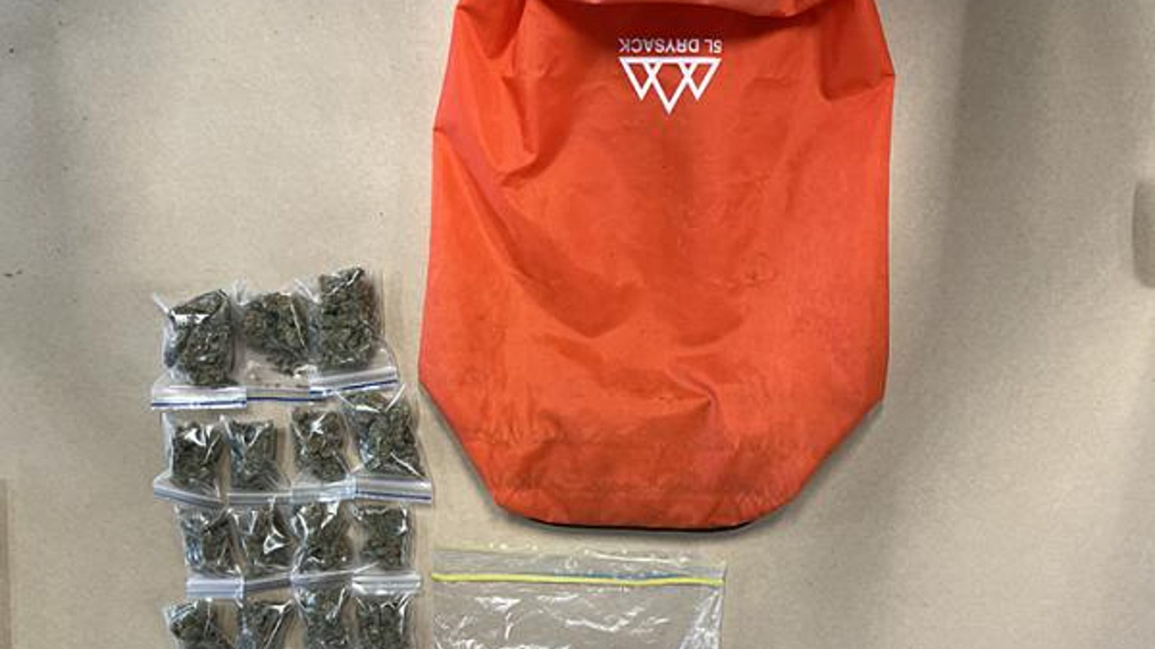 In this image provided by the New Zealand Police items donated to a charity story including marijuana and cash are displayed in Southland, New Zealand, Feb. 18, 2026. (New Zealand Police via AP)