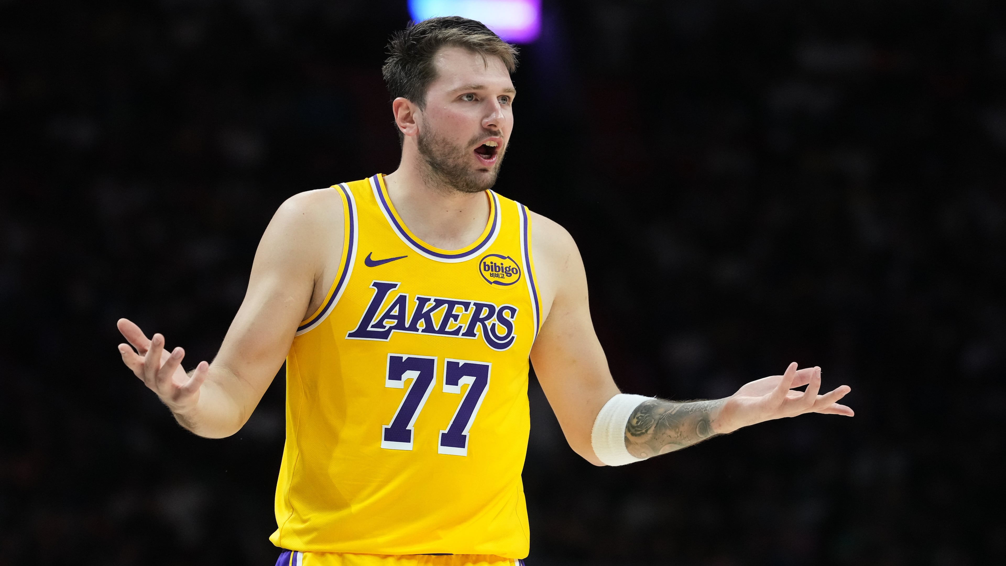 Los Angeles Lakers guard Luka Doncic (77) argues a call during the second half of an NBA basketball game against the Miami Heat, Thursday, March 19, 2026, in Miami. (AP Photo/Lynne Sladky)