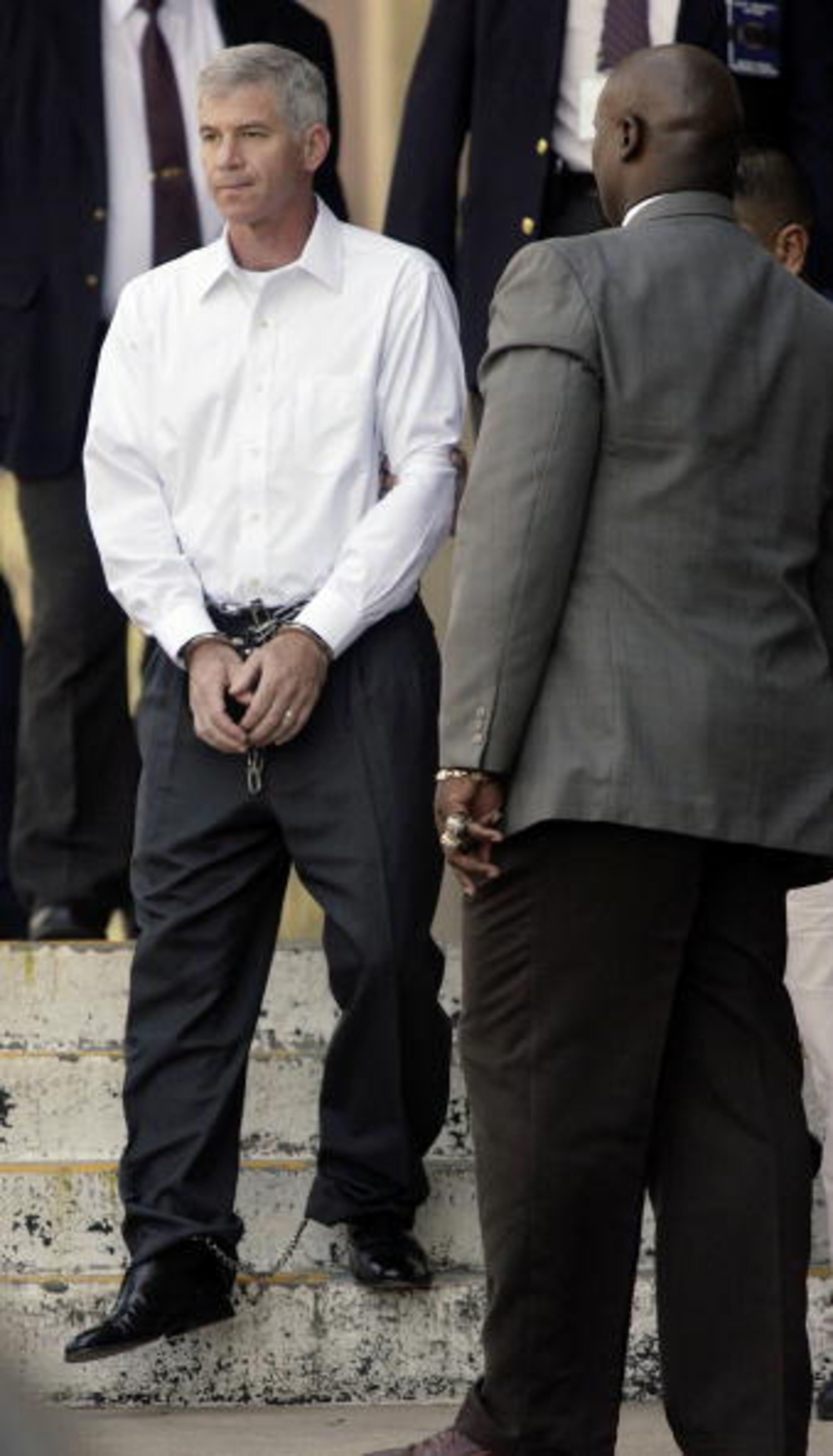 HOUSTON, TX - SEPTEMBER 26: Former Enron CFO Andrew Fastow is led from the Bob Casey U.S. Courthouse after sentencing from his conviction related to the collapse of Enron. September 26, 2006 in Houston, Texas. Fastow testified against his former bosses Kenneth Lay and Jeff Skilling and received a six-year sentence. (Photo by Dave Einsel/Getty Images)