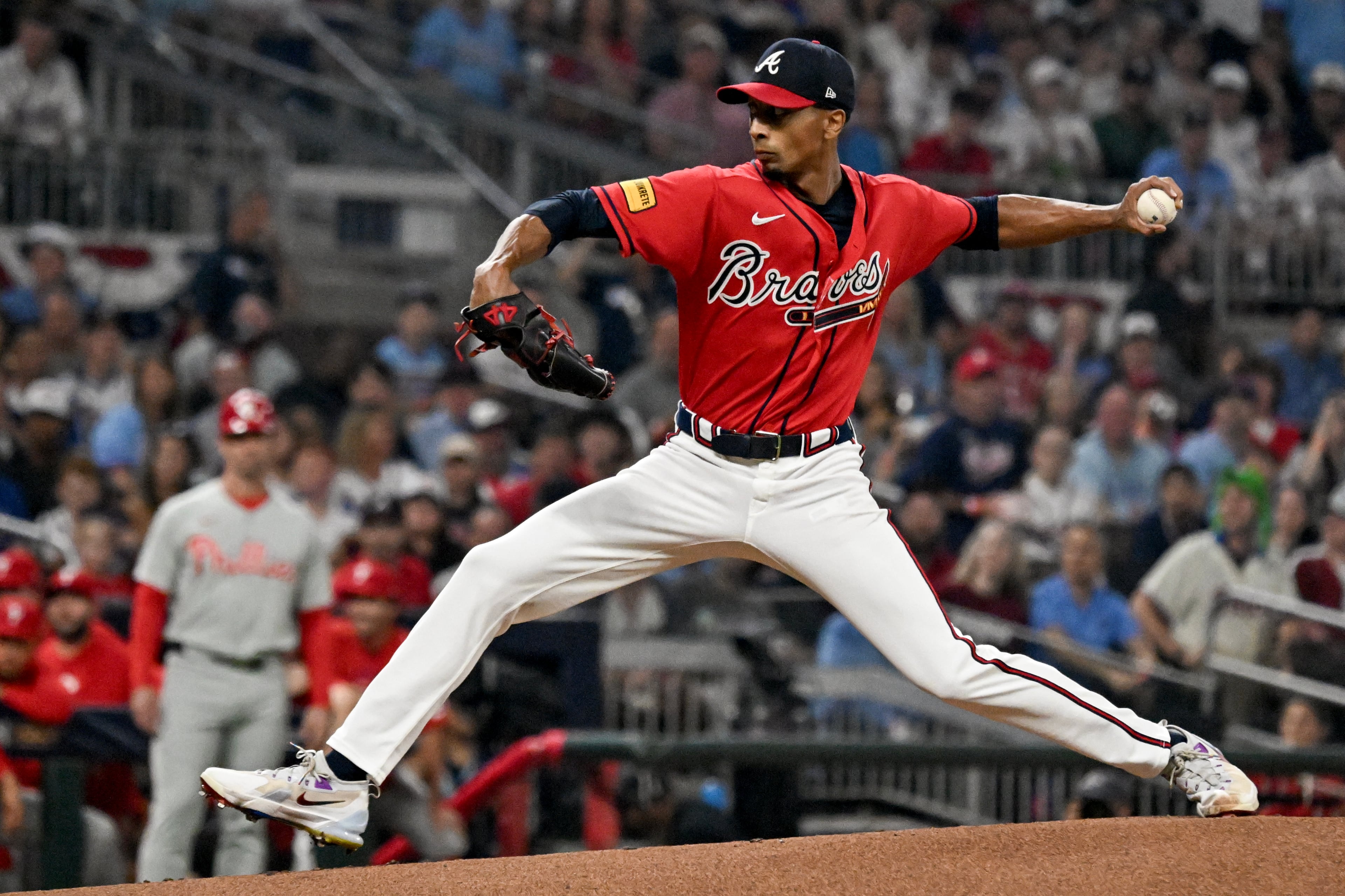 Braves pitcher Ray Kerr delivers to a Phillies batter during Game 3 of their NL Wild Card Series on Thursday, Oct. 1, 2026, in Atlanta. Kerr was traded to the Braves in December 2023. (Hyosub Shin/AJC)