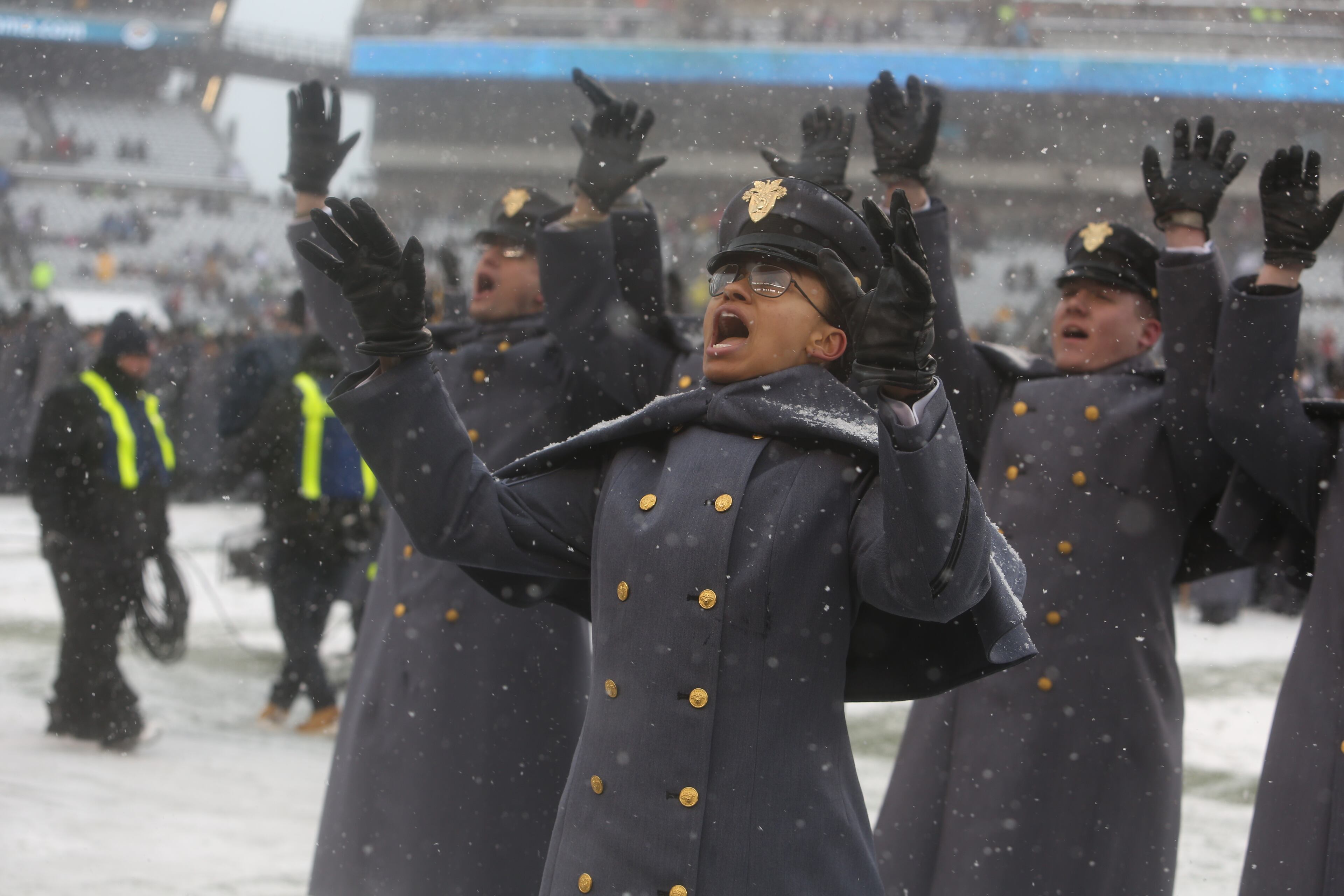 First Captain Simone Askew, the first African-American woman to lead the Corps of Cadets at West Point, ceremoniously shouts as she leads the "march on" of Army Cadets before the 118th meeting of the annual Army Navy football game Saturday Dec. 9, 2017 in Philadelphia. (AP Photo/Jacqueline Larma)