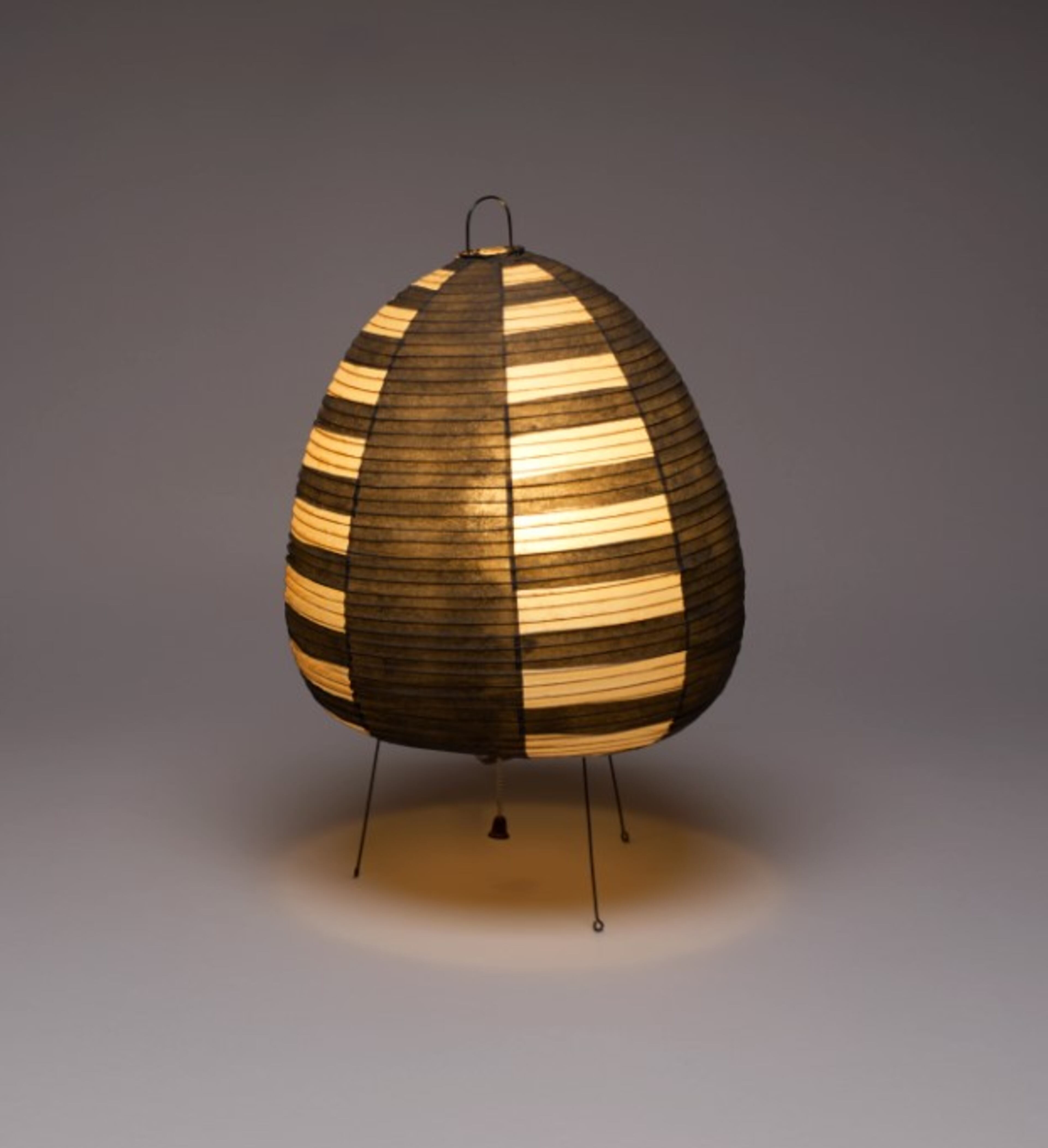 Akari (model 1A) lamp, designed ca 1954 by Isamu Noguchi, is on display at the High Museum. The lamp is made of natural mulberry paper with overlaid black-painted panels, fine bamboo and hand-shaped metal frame and original electrical components. (Courtesy of the High Museum of Art)