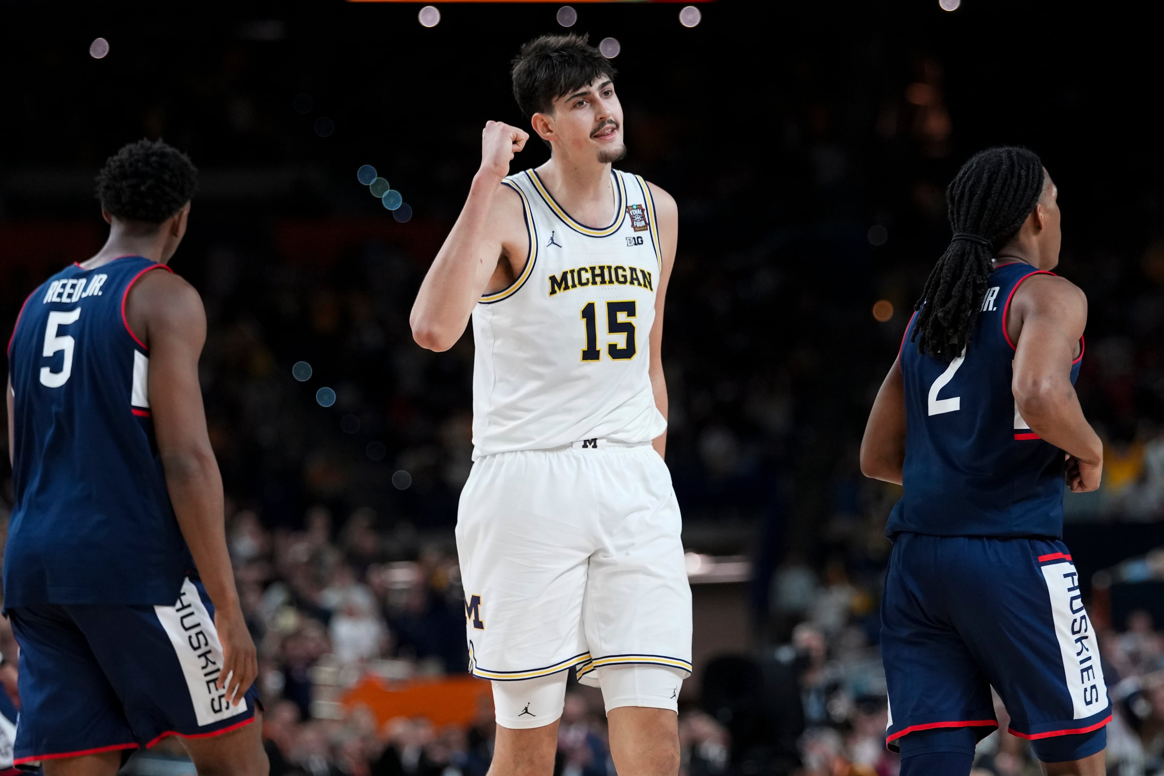 Michigan center Aday Mara (15) celebrates a basket against UConn during the second half of the NCAA college basketball tournament national championship game at the Final Four, Monday, April 6, 2026, in Indianapolis. (AP Photo/Abbie Parr)