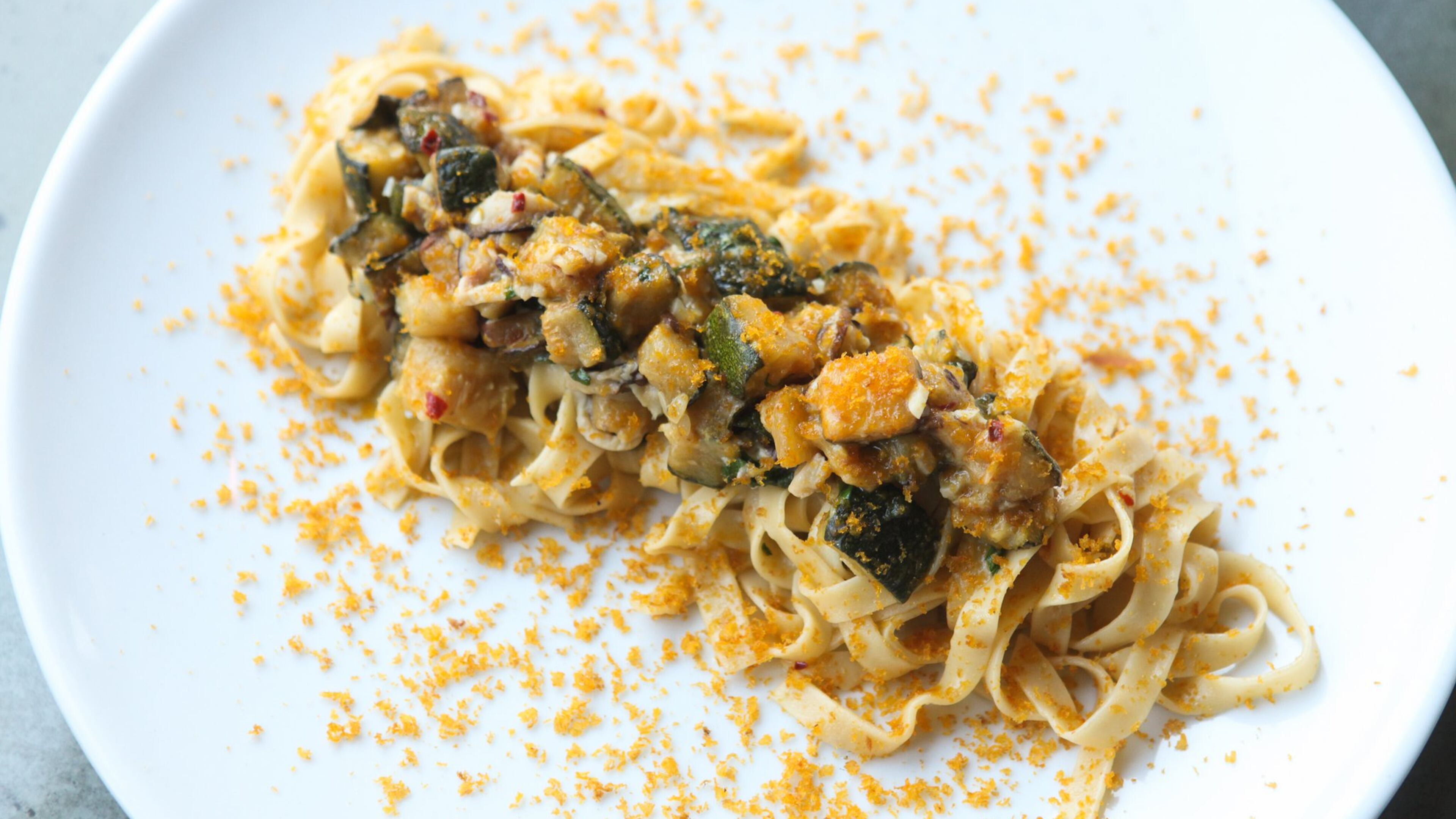 House-made fresh tagliatelle with zucchini, Parmigiano-Reggiano, and bottarga at 8Arm. (styling by Chef Angus Brown ) (Photography by Renee Brock/Special)