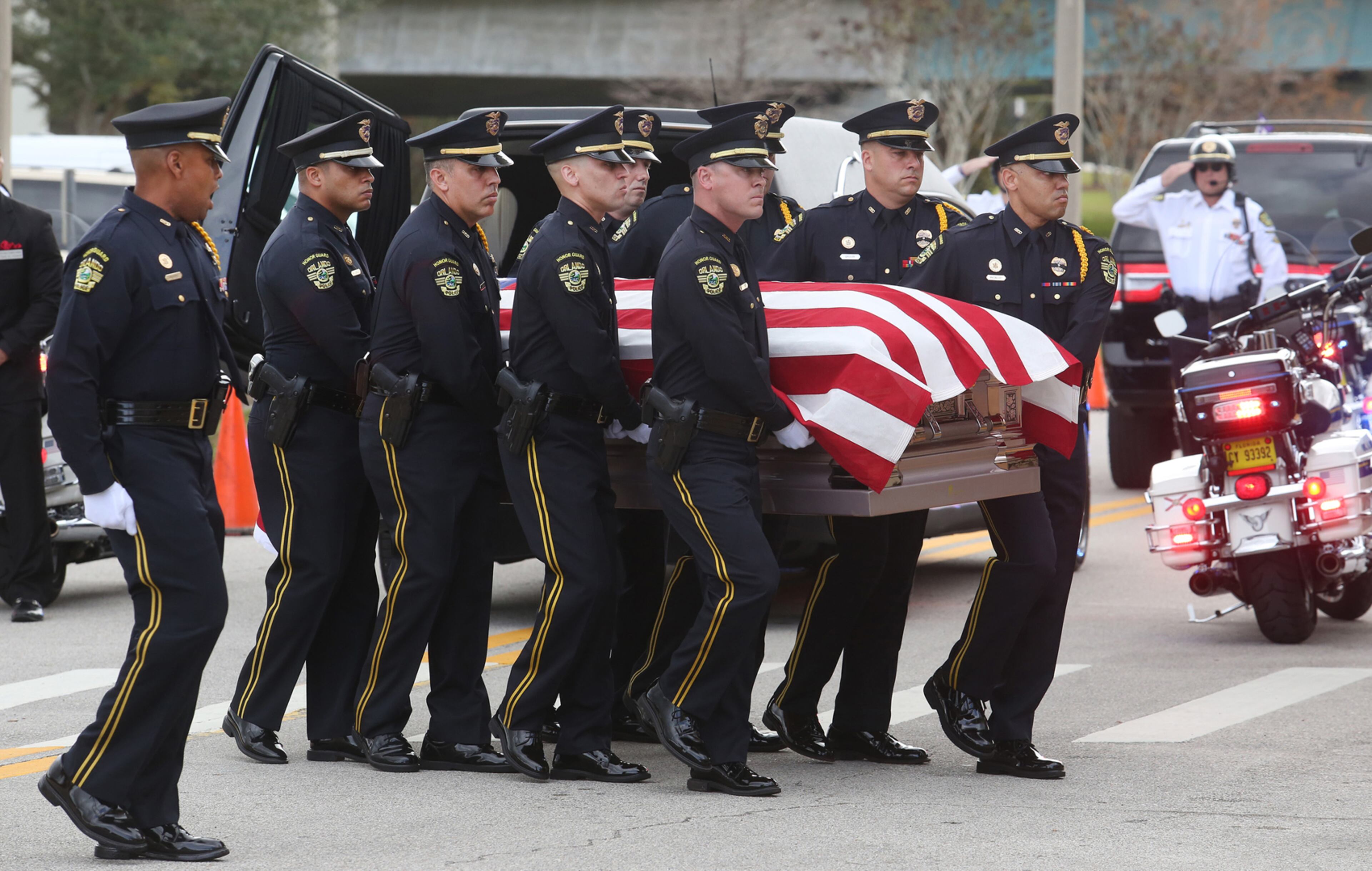 An Orlando Police honor guard carries the flag-draped casket of OPD Master Sgt. Debra Clayton into the First Baptist Orlando Friday, Jan. 13, 2016. Clayton, 42, was shot Monday by Markeith Loyd after she responded to a sighting of him outside a Walmart store. Funeral Services are scheduled for Saturday. (Red Huber/Orlando Sentinel/TNS)