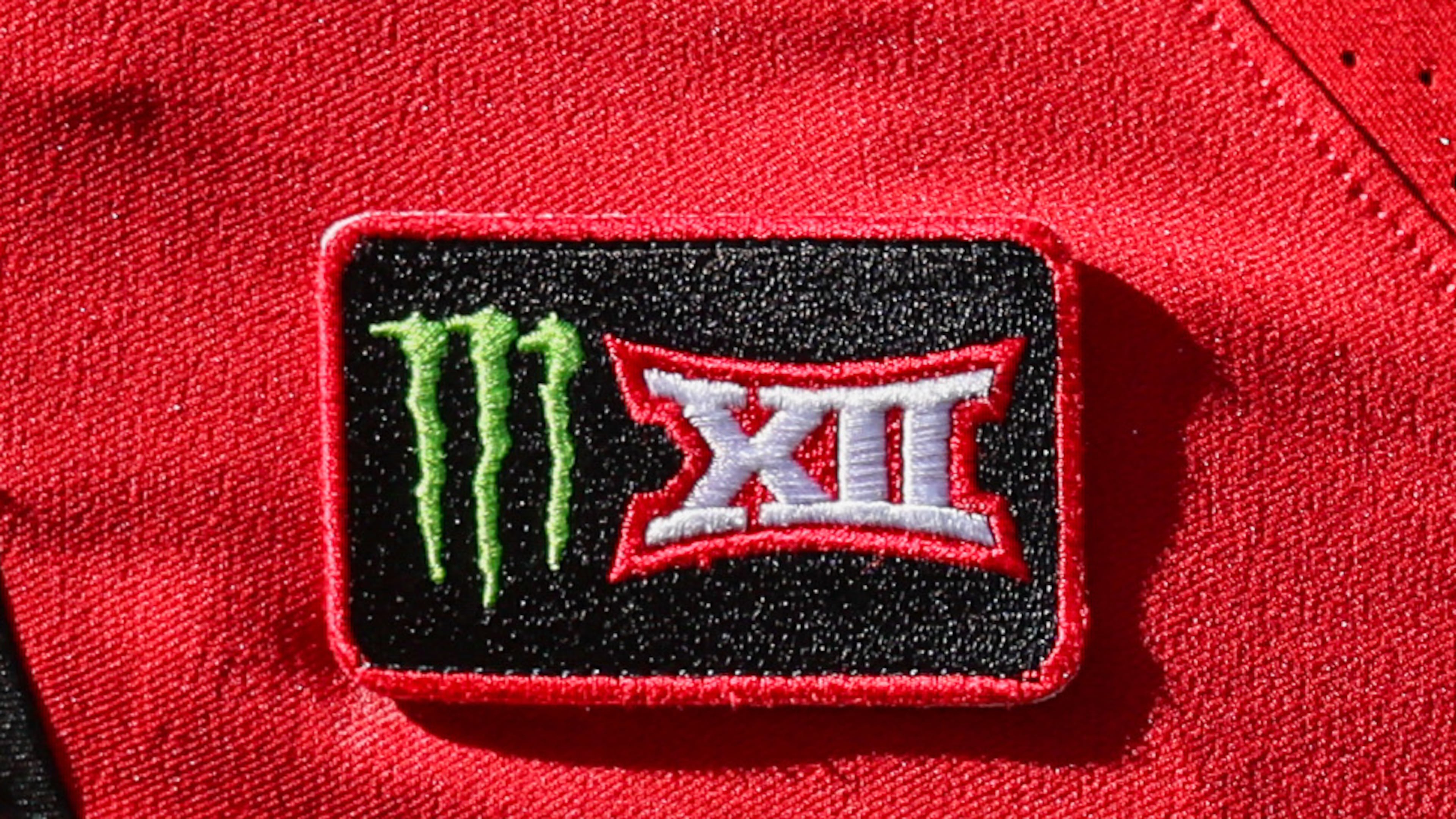 FILE - A Texas Tech player wears a Monster/Big 12 patch on his jersey during an NCAA college football game against Sam Houston State, Sept. 26, 2026, in Lubbock, Texas. (AP Photo/Chase Seabolt, File)