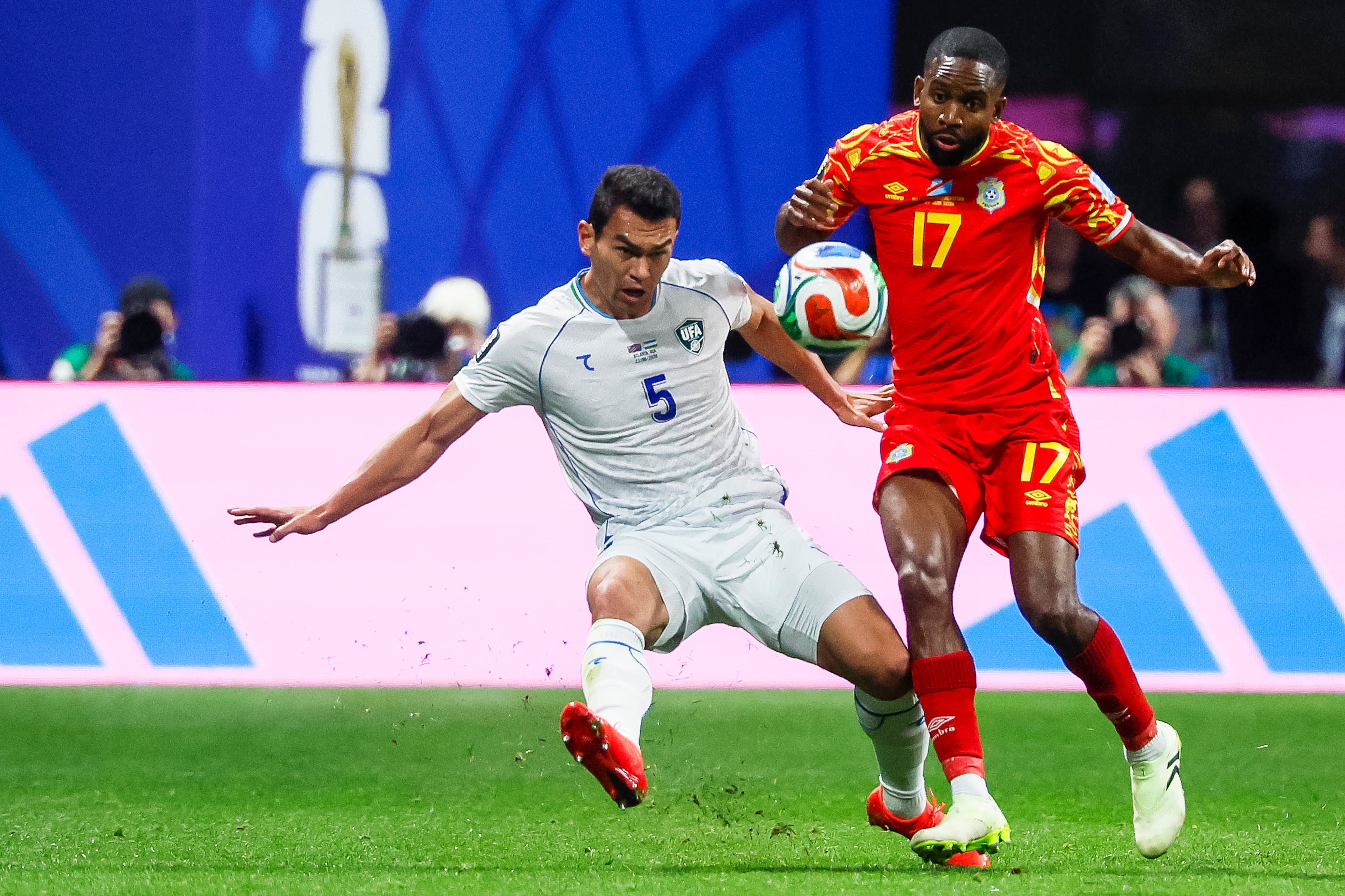 Congo forward Cédric Bakambu (right) controls the ball past Uzbekistan defender Rustam Ashurmatov (left) during the first half of a FIFA World Cup match at Atlanta Stadium (Mercedes-Benz Stadium) on Saturday, June 27, 2026, in Atlanta. (Miguel Martinez/AJC)