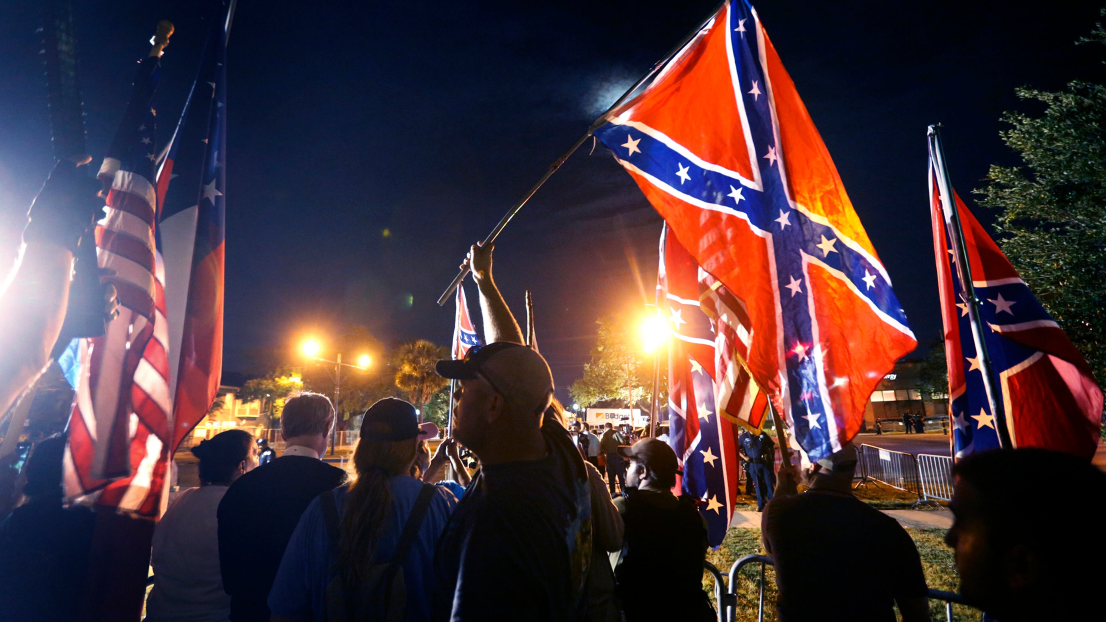Demonstrators who supports keeping Confederate era monuments protest before the Jefferson Davis statue was taken down in New Orleans, Thursday, May 11, 2017. (AP Photo/Gerald Herbert)