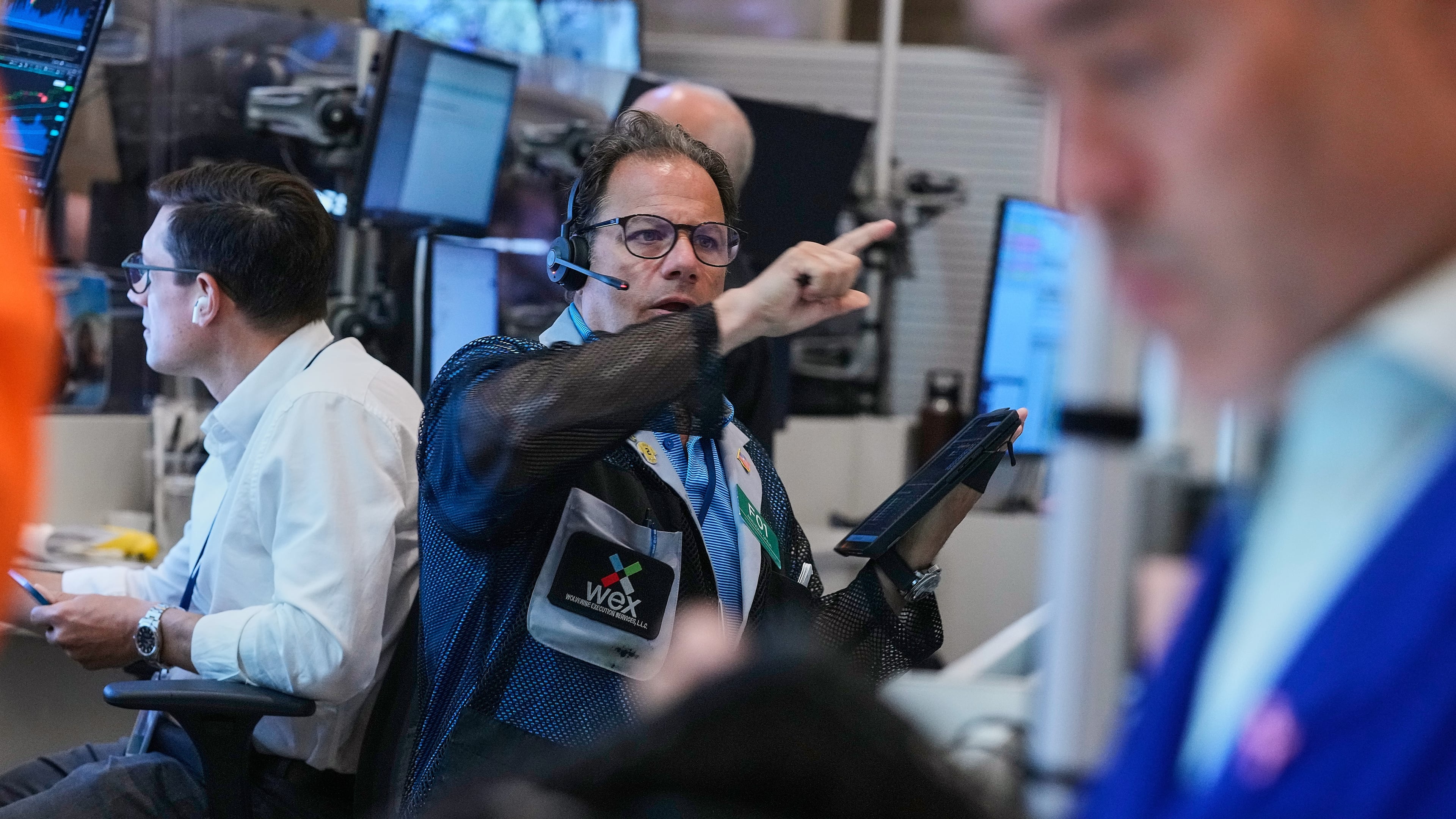Optons trader Anthony Spina, center, works on the floor of the New York Stock Exchange, Monday, June 15, 2026. (AP Photo/Richard Drew)