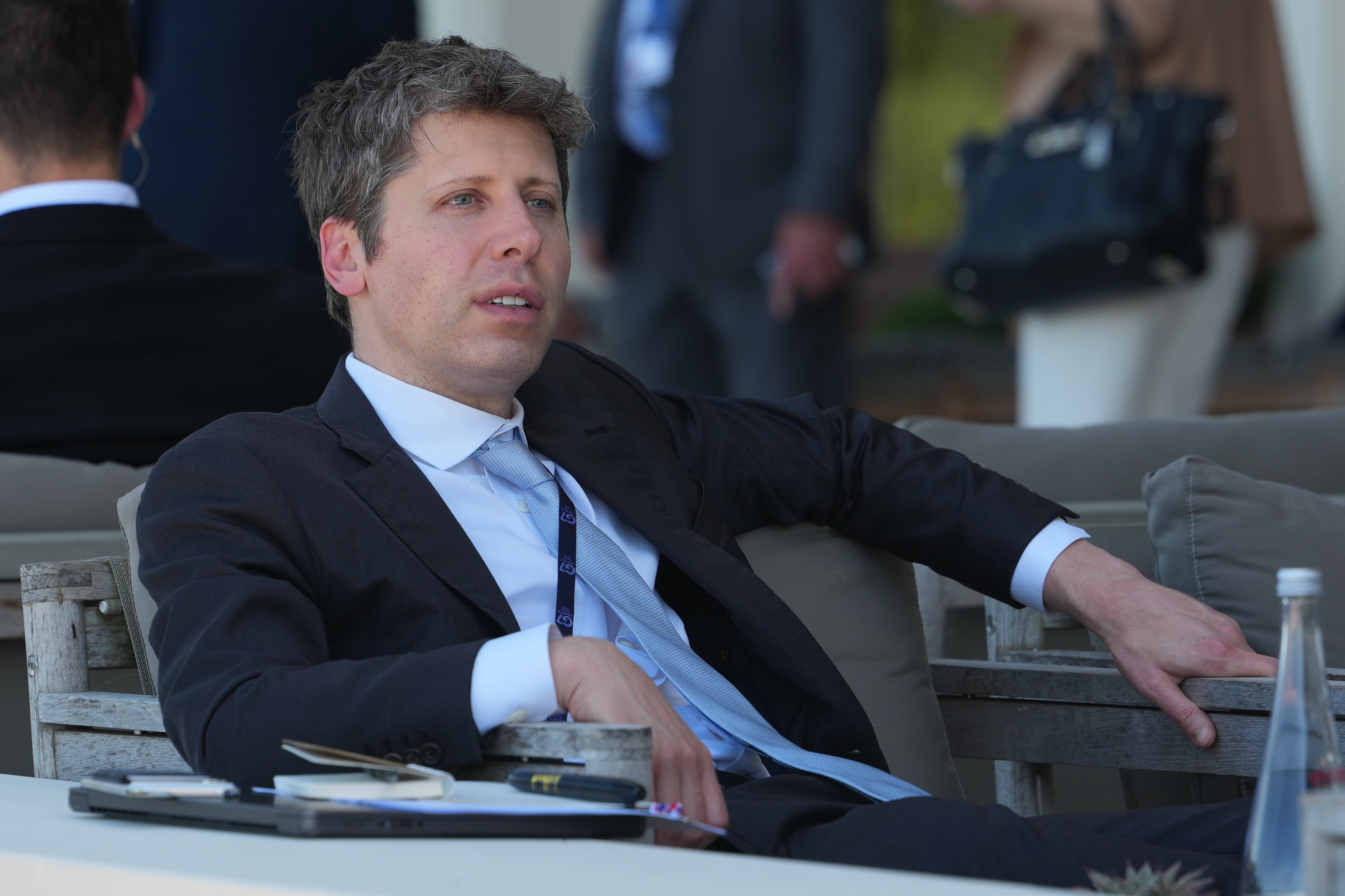 CEO of OpenAI Sam Altman — pictured at the G7 summit in June — called for domestic and international regulation of AI development in congressional testimony in 2023, but three years later the company has been criticized for creating an “AI arms race” and other existential threats through rapid deployment of competing algorithms. (Julia Demaree Nikhinson/AP)
