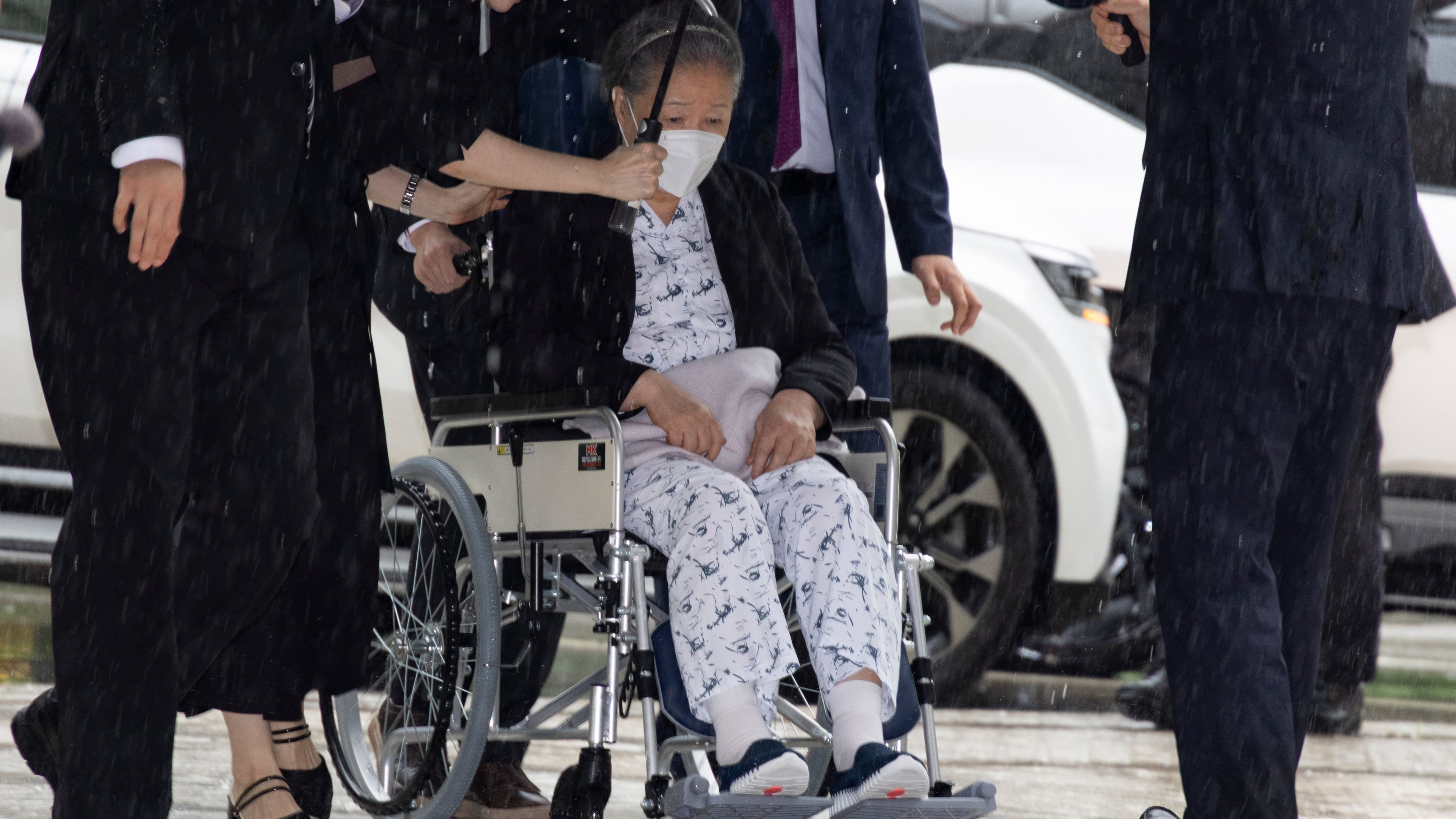 Unification Church leader Hak Ja Han, on the wheelchair, arrives for the sentencing hearing on allegations of bribery and political funding, at the Seoul Central District Court in Seoul, South Korea, Monday, Aug. 31, 2026. (Jeon Heon-kyun/Pool Photo via AP)