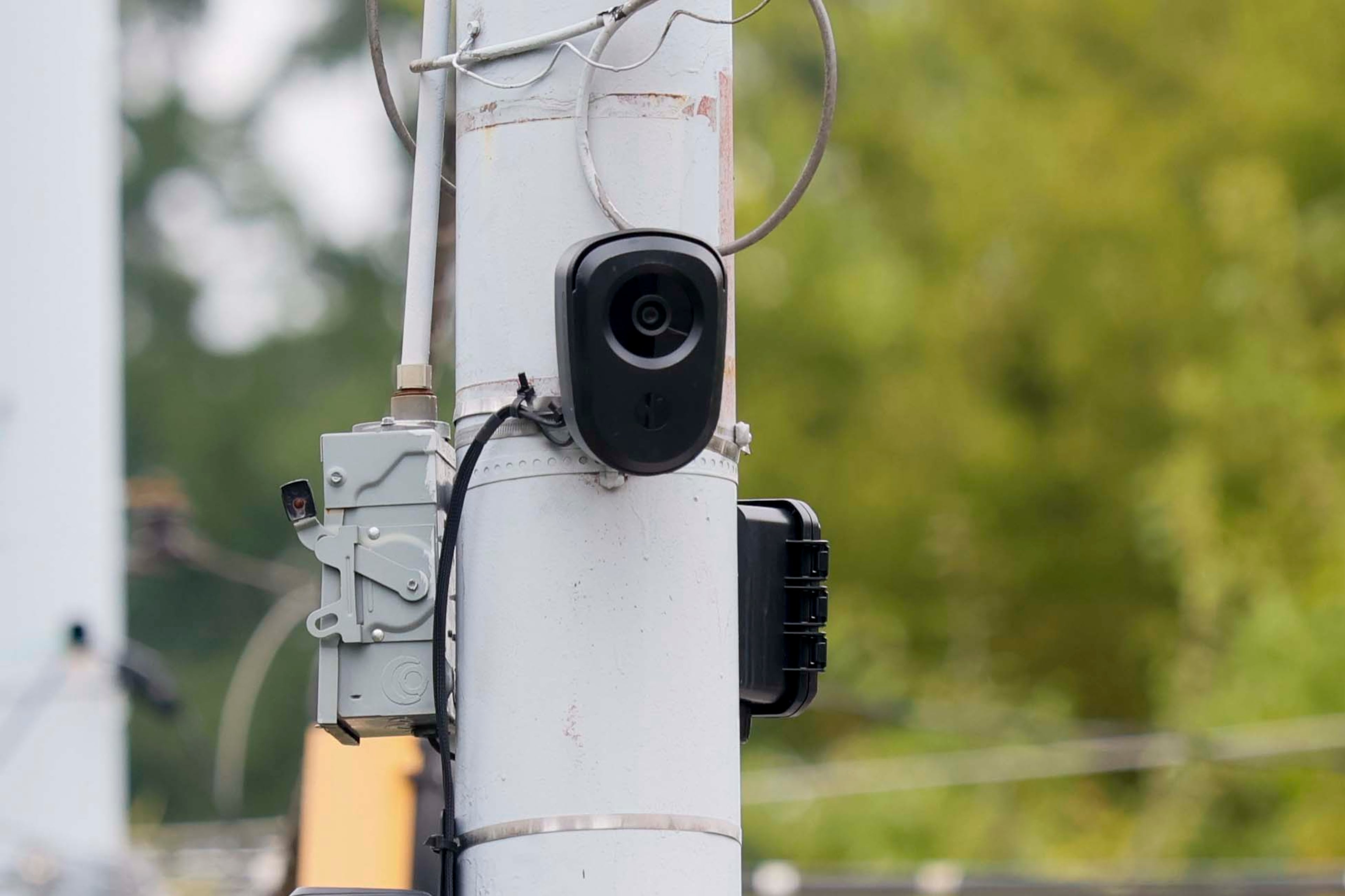 A Flock Safety camera is visible at the intersection of DeKalb Avenue and Rockyford Road in Kirkwood on Sunday, Oct. 4, 2026. (Miguel Martinez/AJC)