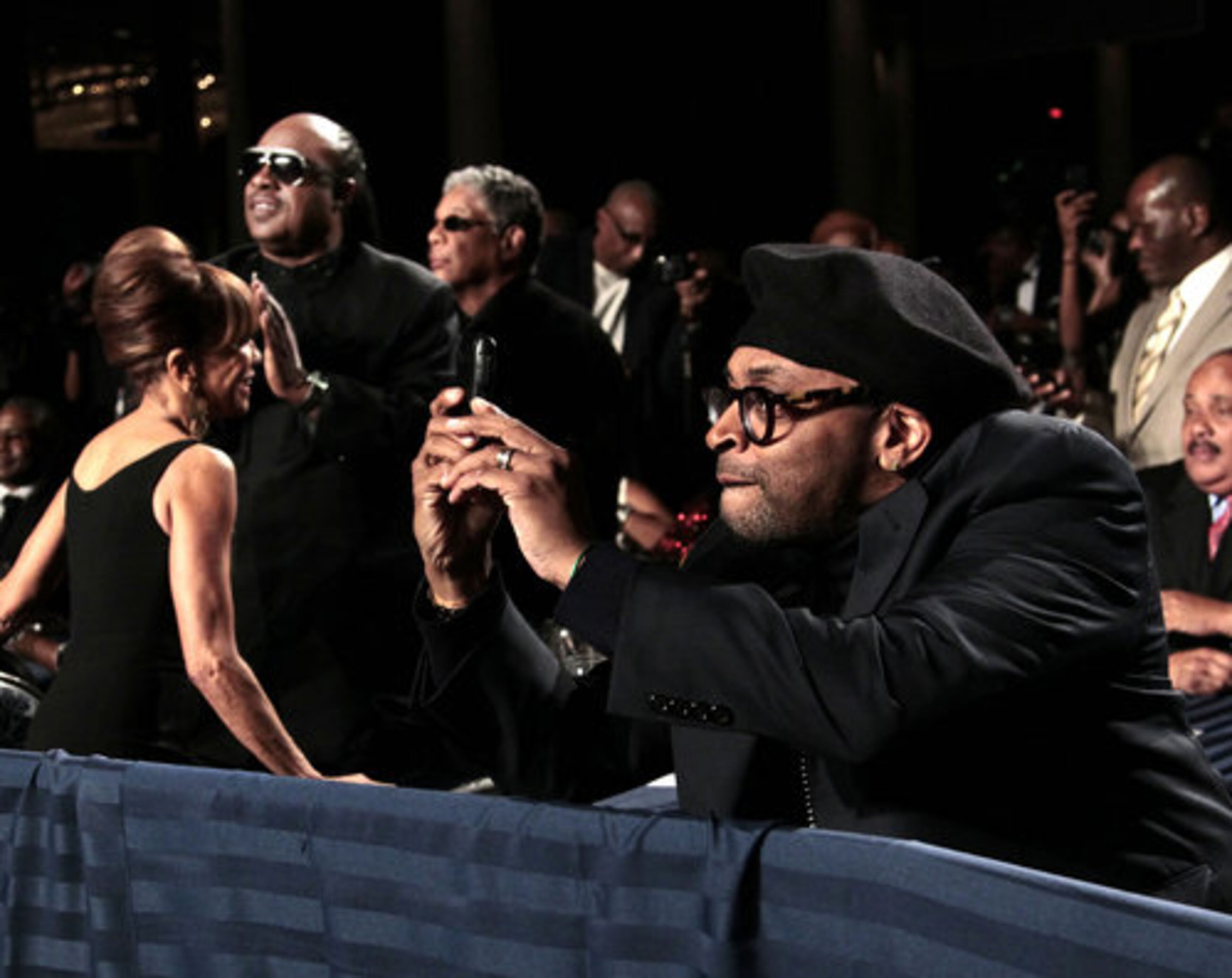 Filmmaker Spike Lee, right, uses his smartphone to take a picture of President Barack Obama at the National Action Network's Keepers of Dream Awards Gala in New York.