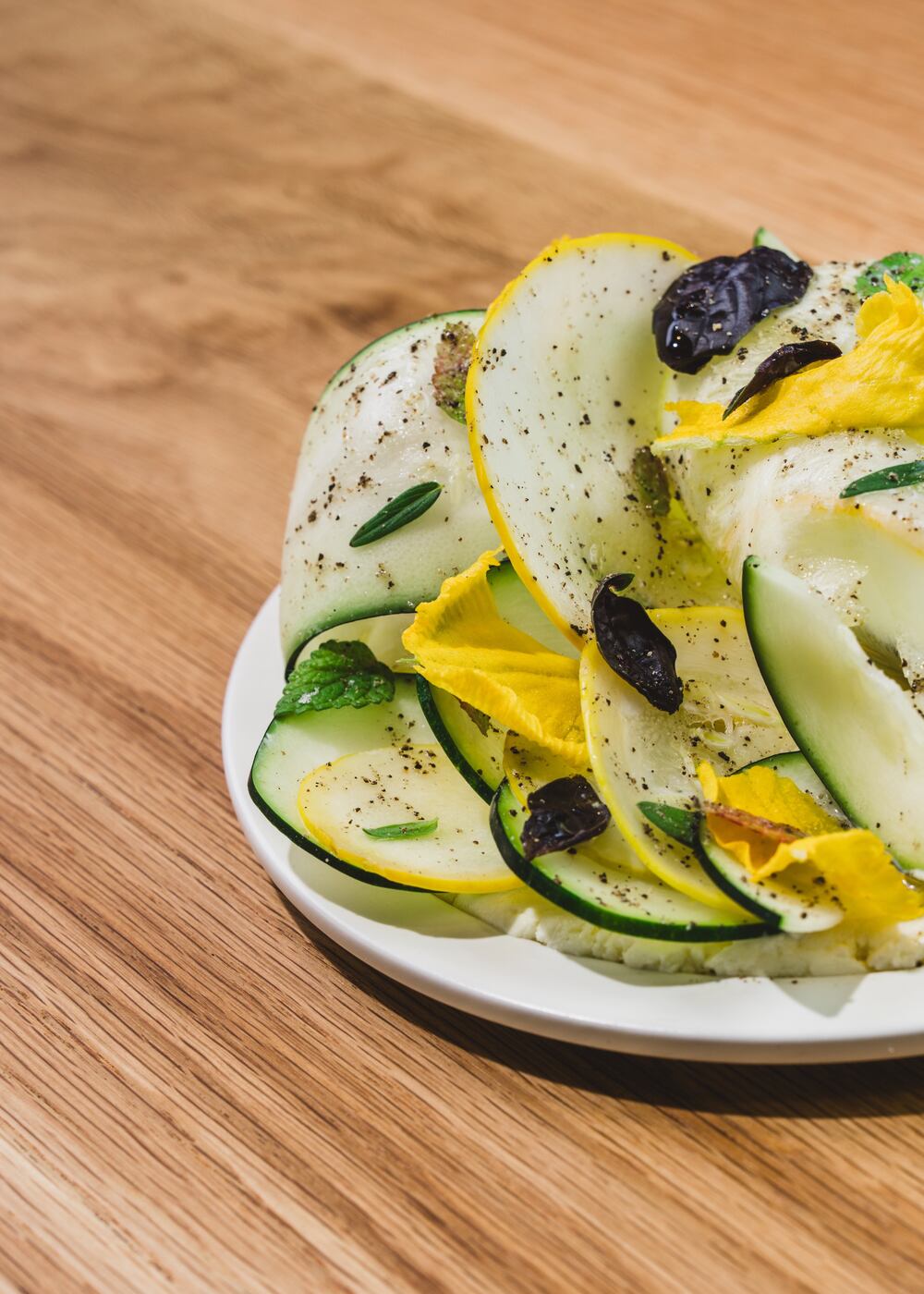 Summer squash arranged in a bed of farmer's cheese at So. Fox. (Dave Crawford/Courtesy of So. Fox)
