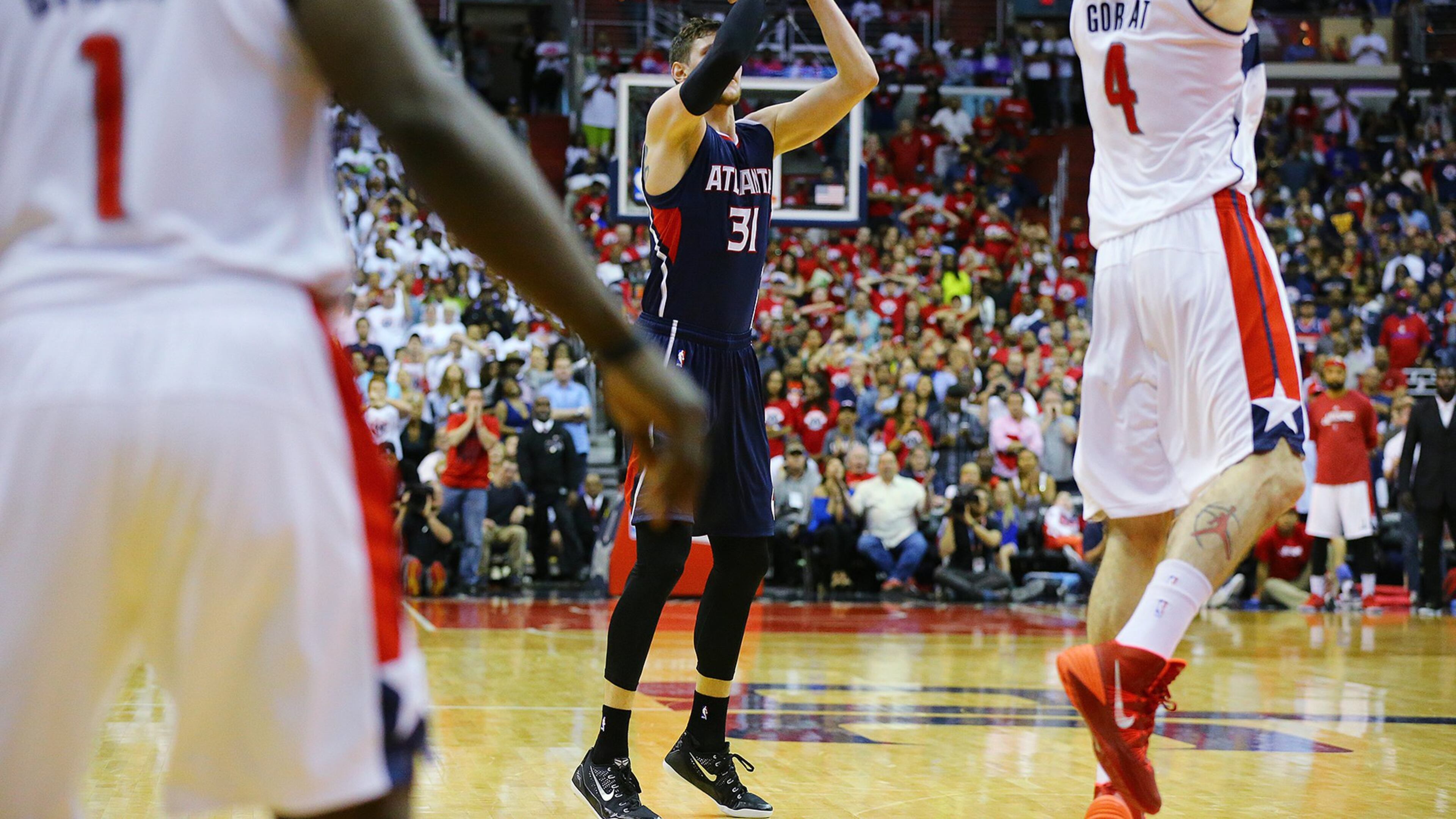 Hawks’ Mike Muscala hits a 3-pointer in the final seconds to tie the game at 101 against the Wizards in their Eastern Conference semifinals Game 3 at the Verizon Center on Saturday, May 9, 2015, in Washington, D.C. The Wizards held on to beat the Hawks with a shot by Paul Pierce as time expired in the game to win 103-101. Curtis Compton / ccompton@ajc.com
