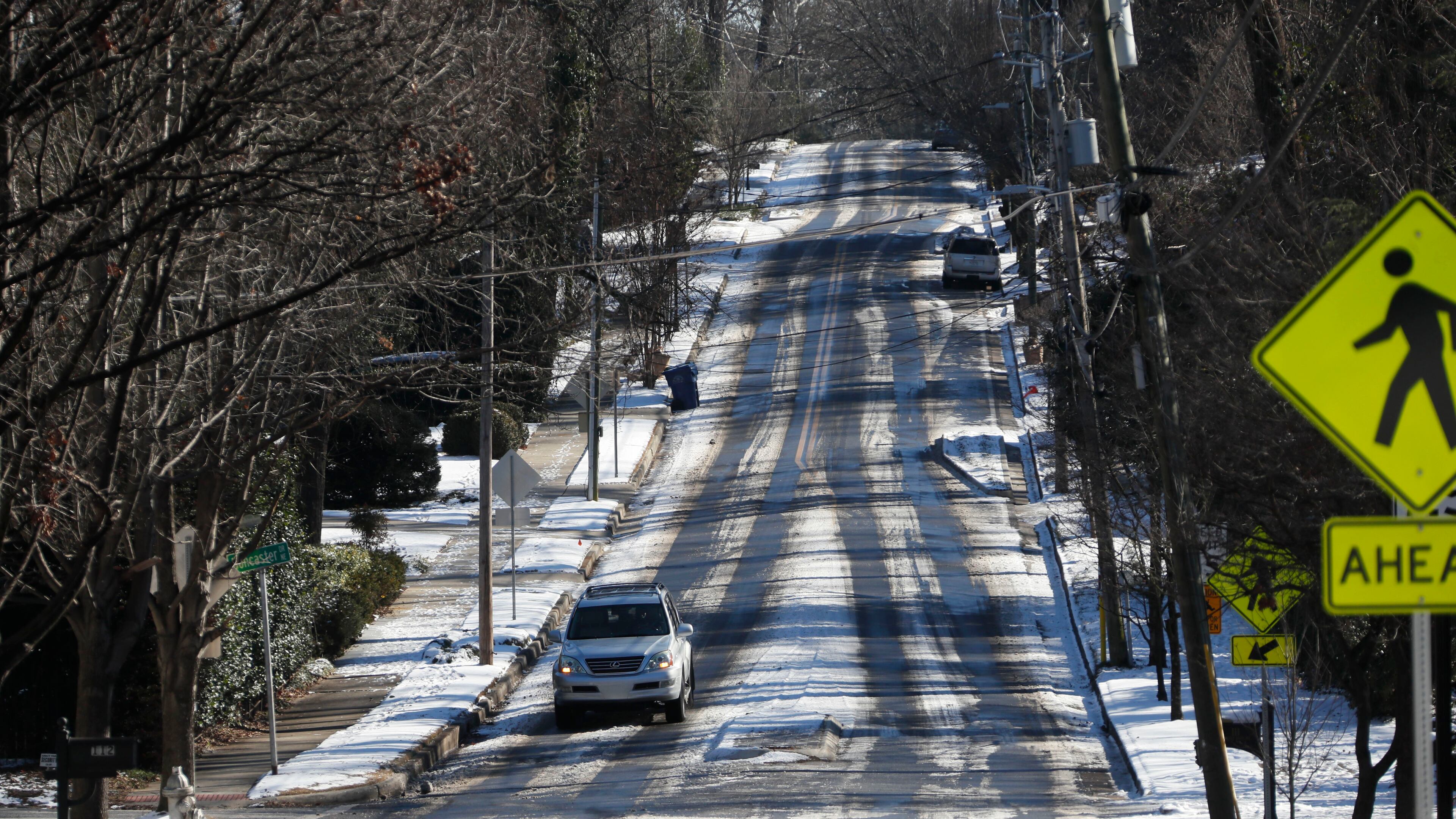 The main arteries were clear on Jan. 17, 2018, but surface streets and side roads , liker Beverly Road in Atlanta, still had patches of ice and snow for motorists to deal with that morning.
