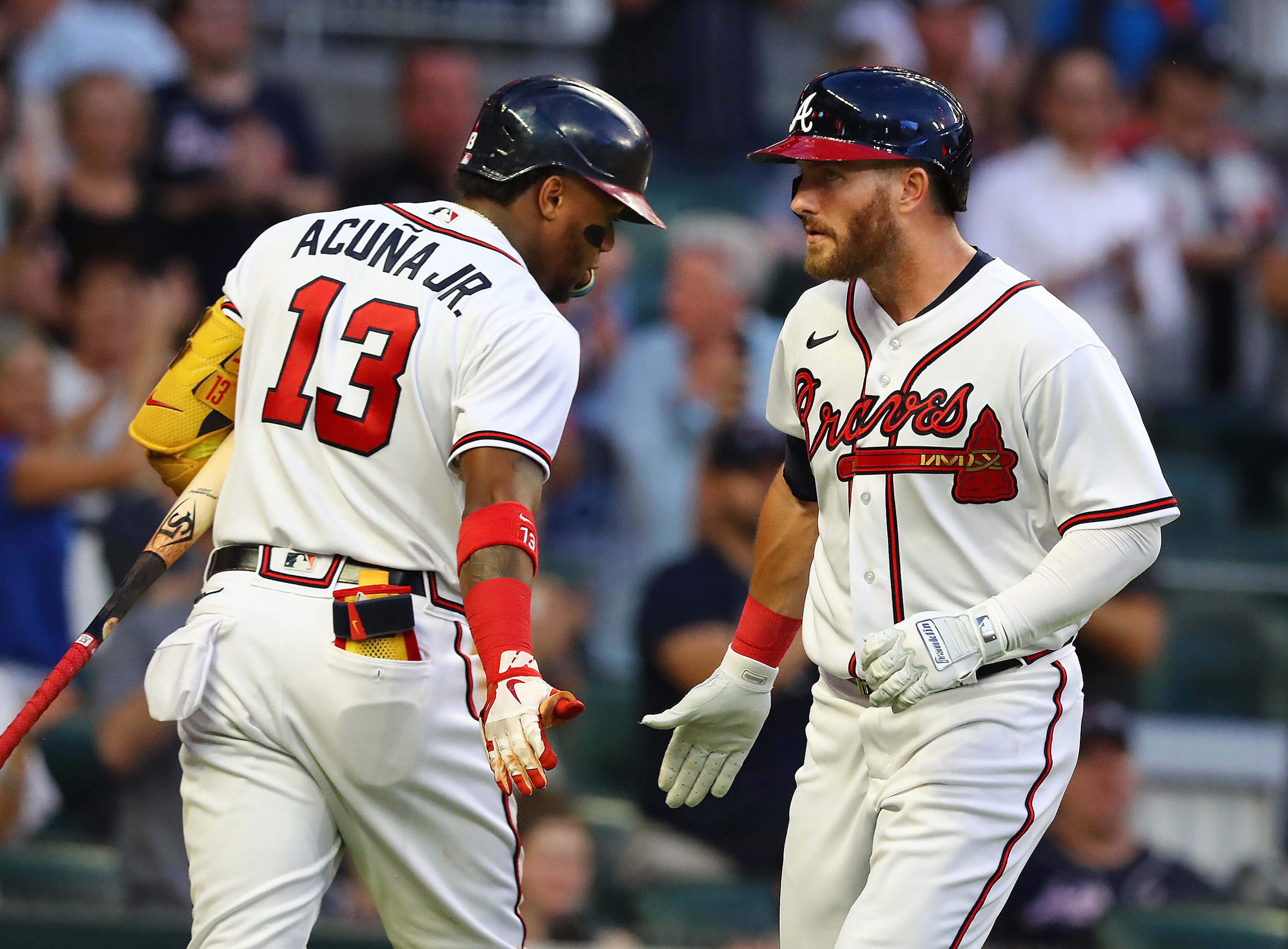Braves outfielder Robbie Grossman gets five from Ronald Acuna at home hitting a solo home run against the New York Mets for a 1-0 lead during the third inning in a MLB baseball game on Tuesday, August 16, 2022, in Atlanta. “Curtis Compton / Curtis Compton@ajc.com