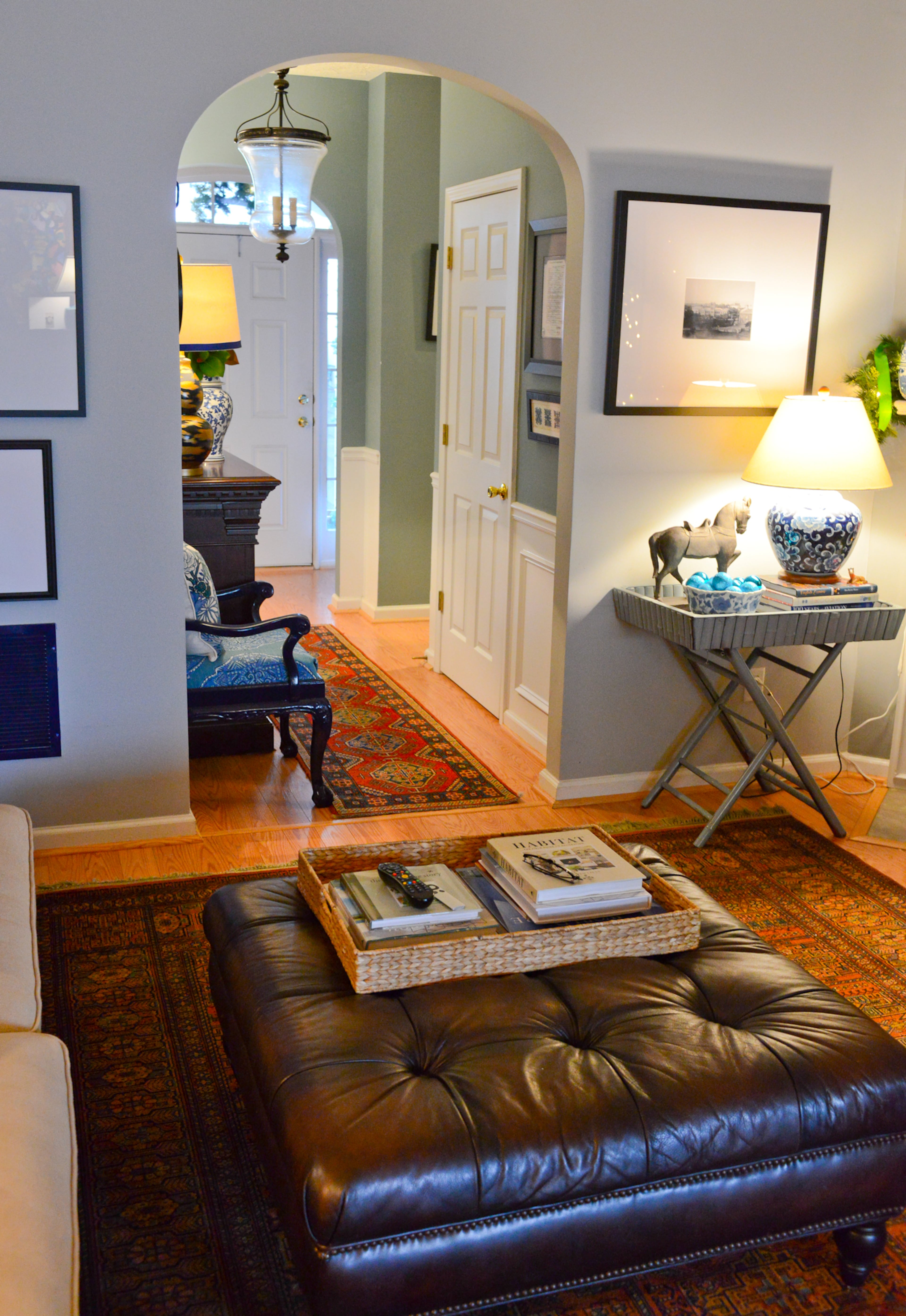 Archways provide architectural interest in the living room, while vintage oriental rugs that homeowner Travis Snyder procured from Craigslist provide texture and color throughout his Union City home.