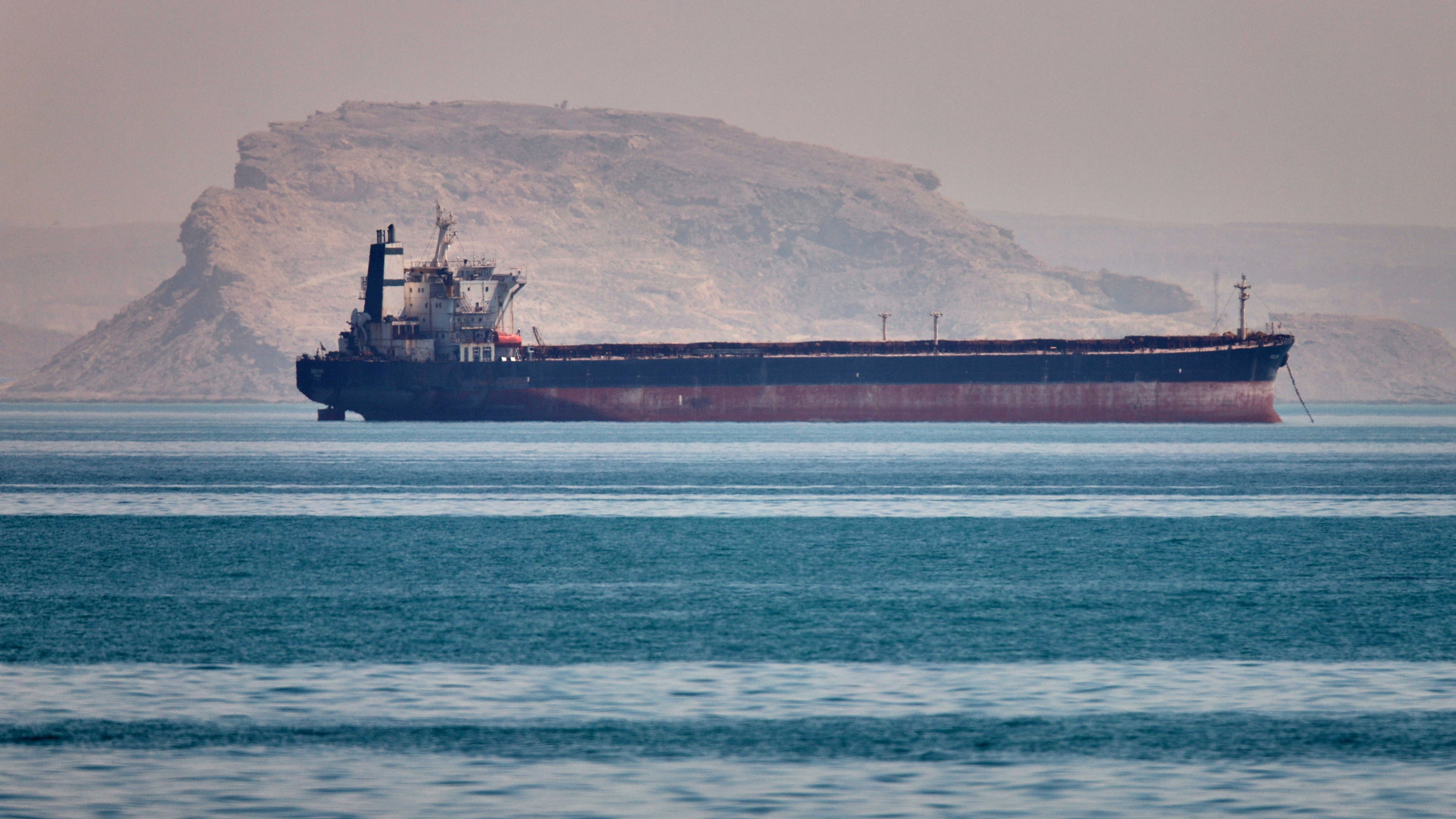 A bulk cargo ship sits at anchor in the Strait of Hormuz off Bandar Abbas, Iran, Saturday, May 2, 2026.(Amirhosein Khorgooi/ISNA via AP)