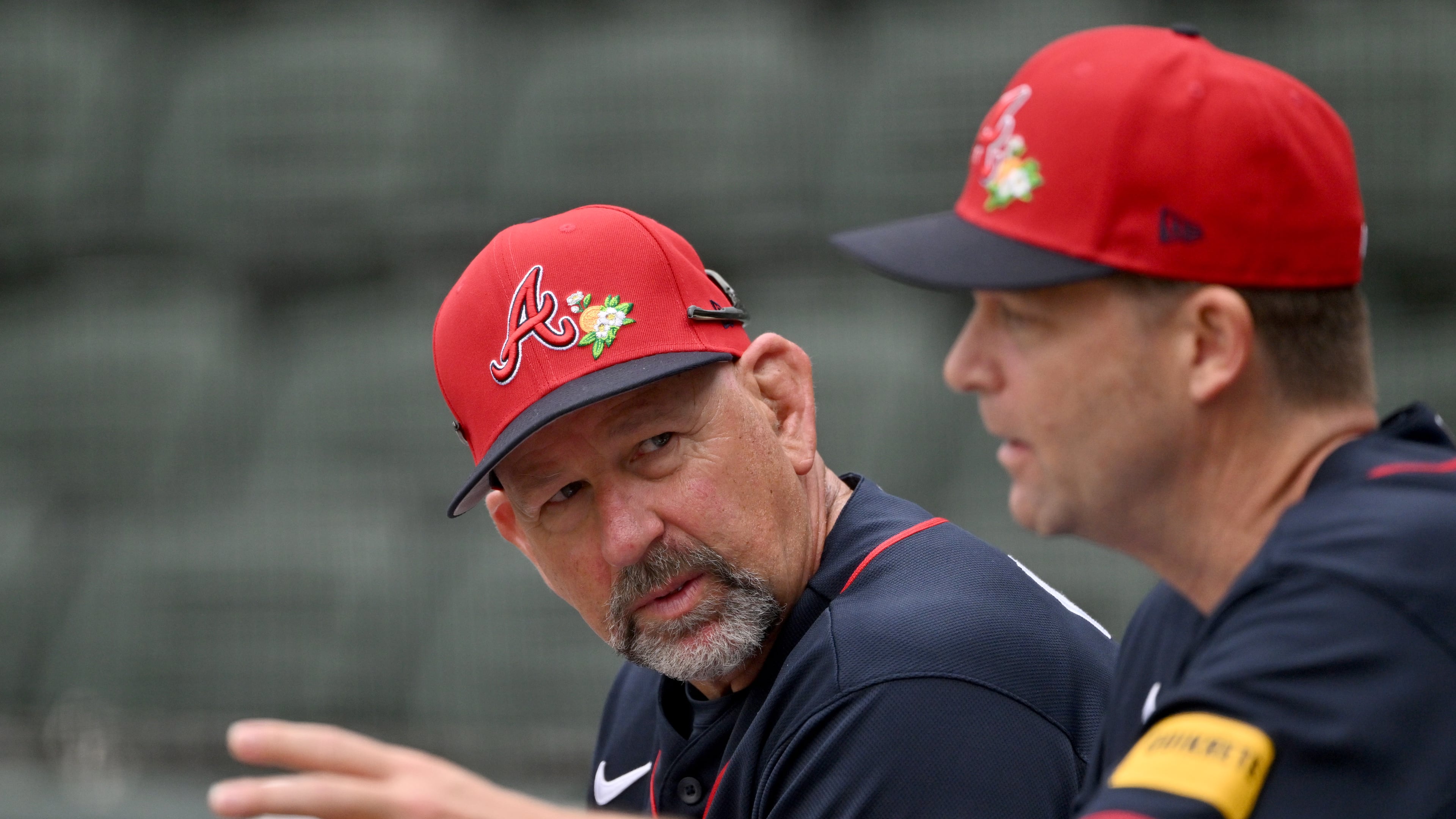 Braves manager Walt Weiss (left) — pictured talking with hitting coach Tim Hyers in February — said that while Atlanta having MLB's best spring training record doesn't mean much, he feels the team's energy and focus are a good omen for the regular season. (Hyosub Shin/AJC)