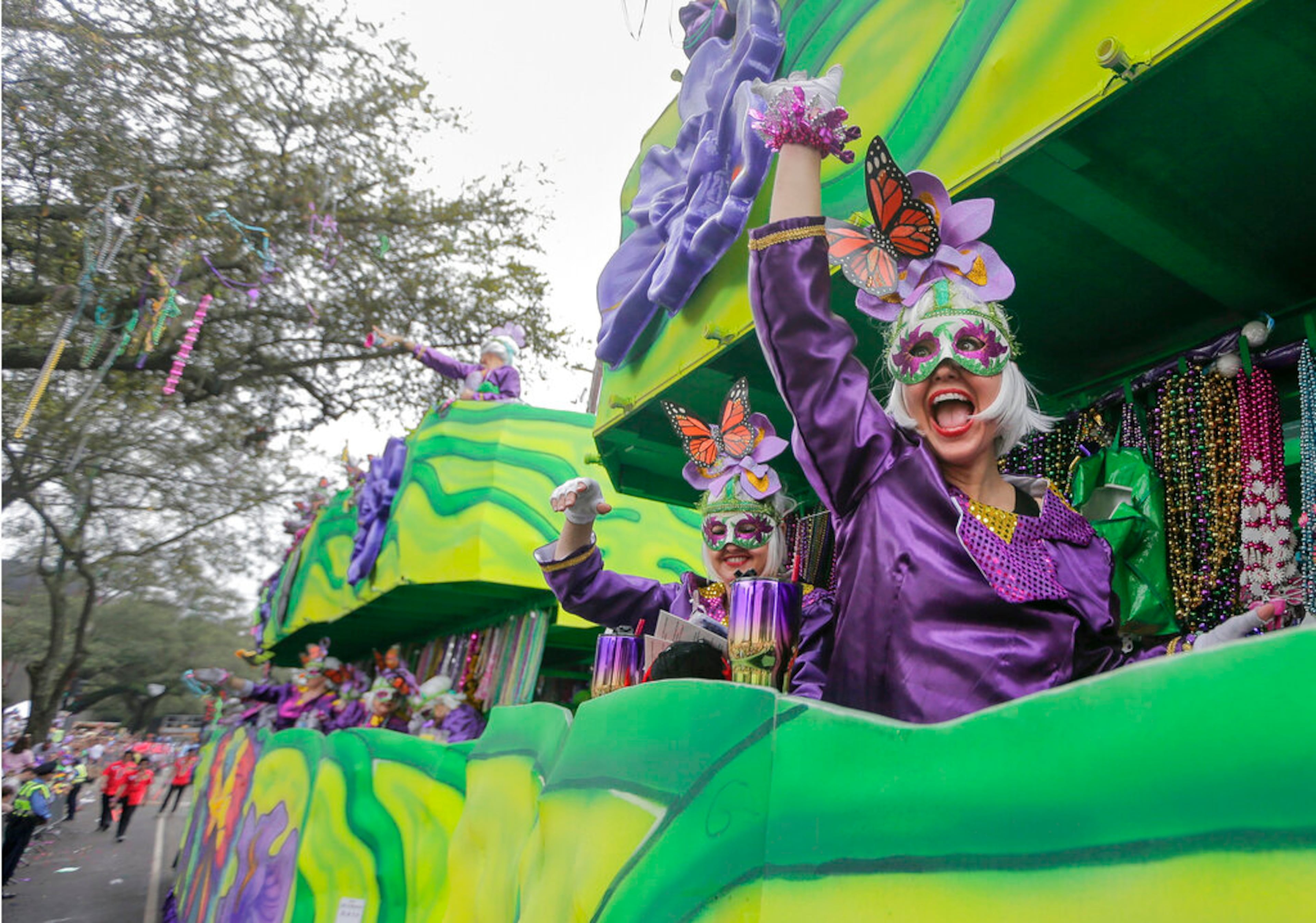 The Krewe of Iris parade makes its way along the Uptown route in New Orleans on Saturday, March 2, 2019. Iris was founded in 1917, and is the oldest all-female krewe in New Orleans. (Brett Duke/NOLA.com/The Times-Picayune via AP)