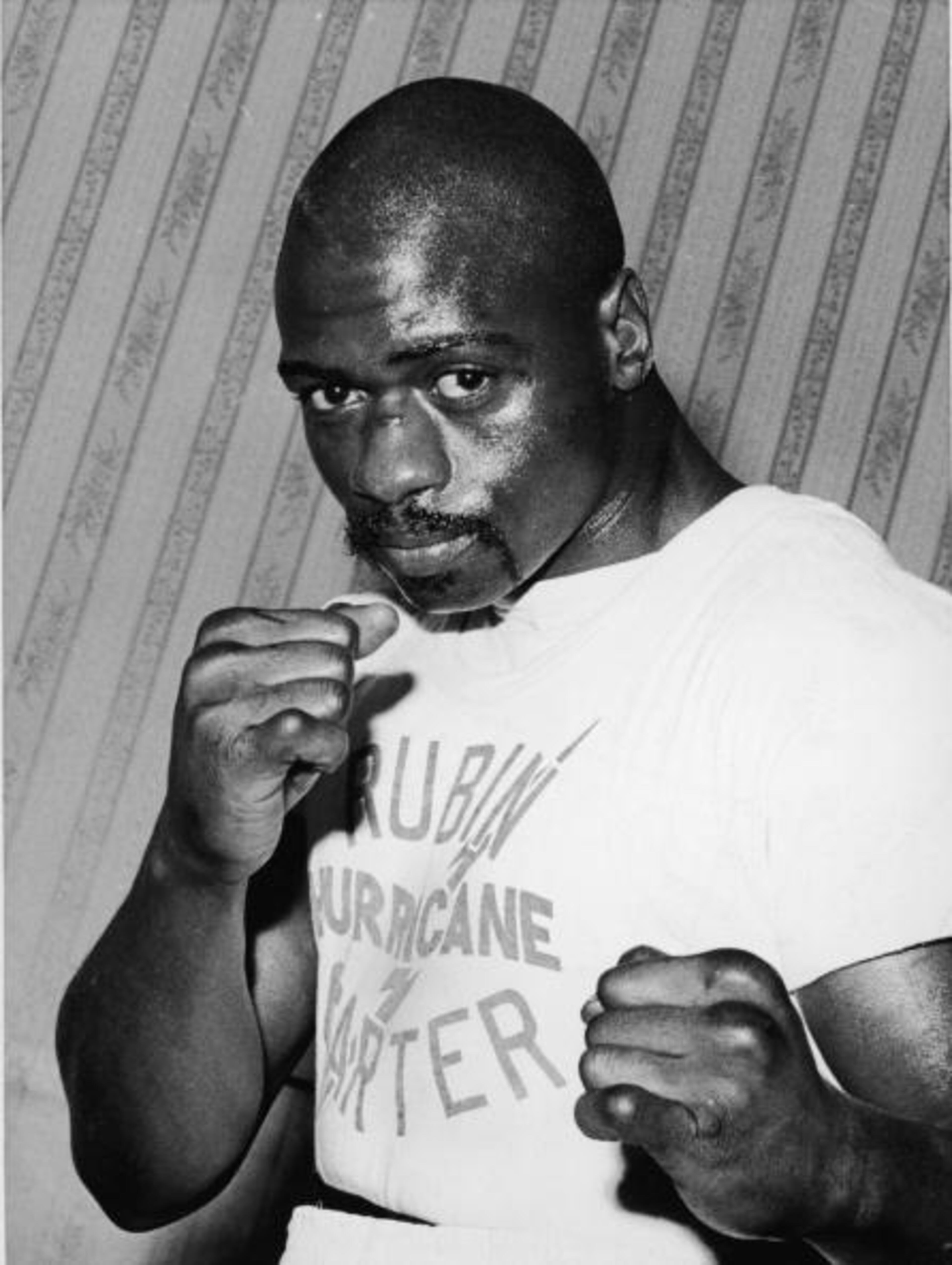 Portrait of American middleweight boxer Rubin 'Hurricane' Carter in a fighter's pose at Butcher's Arms, his training headquarters for his upcoming fight against Harry Scott, London, Great Britain, March 2, 1965. (Photo by FPG/Getty Images)