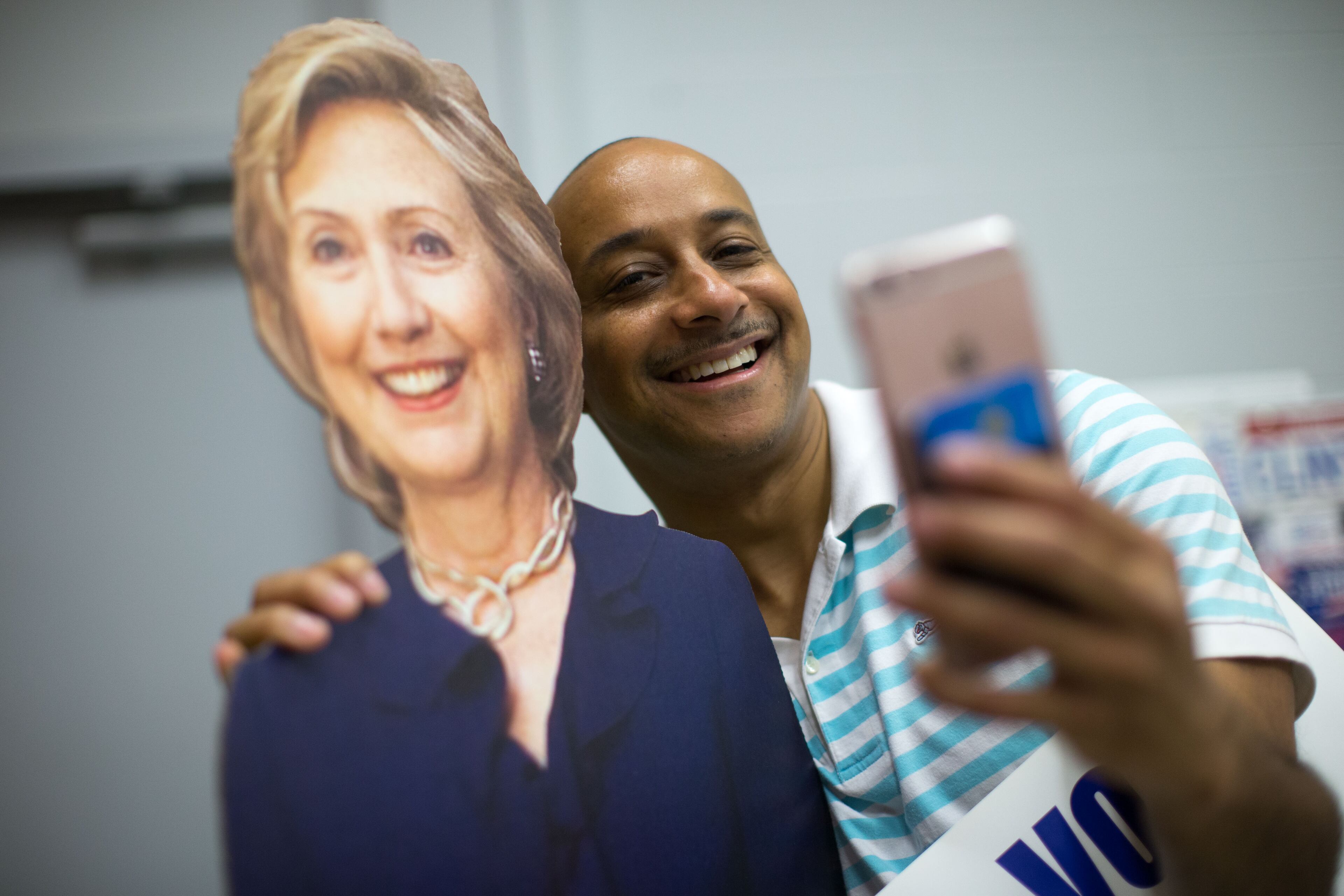 Kelvin Goodwin takes a photo with a cardboard cutout of Democratic presidential candidate Hillary Clinton at the IBEW Local 613 Auditorium, Saturday, June 11, 2016, in Atlanta. Members of the Georgia Democratic Party gathered to elect at-large and alternate delegates to the Democratic National Convention in Philadelphia. BRANDEN CAMP/SPECIAL