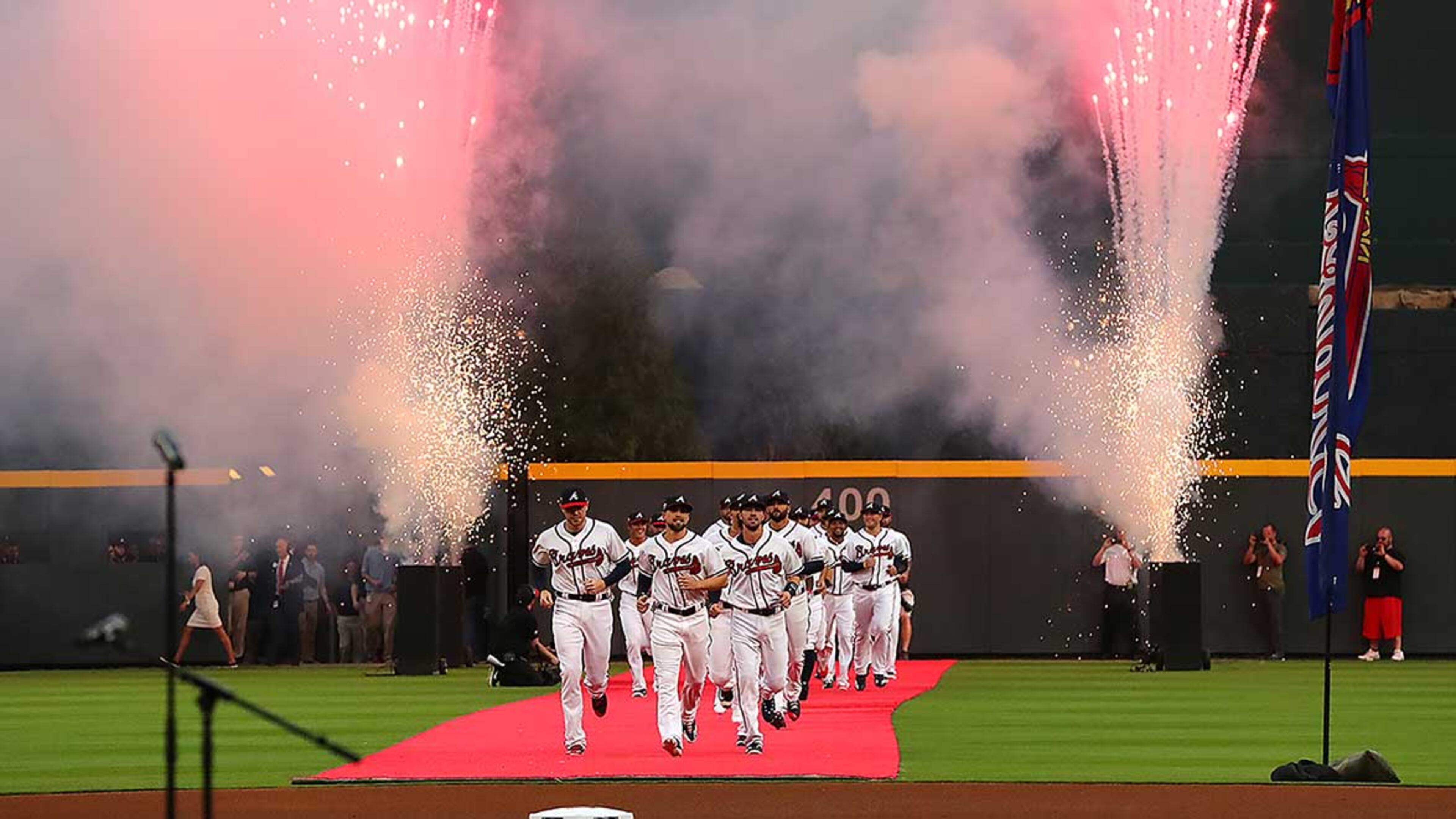 The Atlanta Braves take the field through fireworks on red carpet for the home opener against the Padres at the new SunTrust Park on Friday, April 14, 2017.