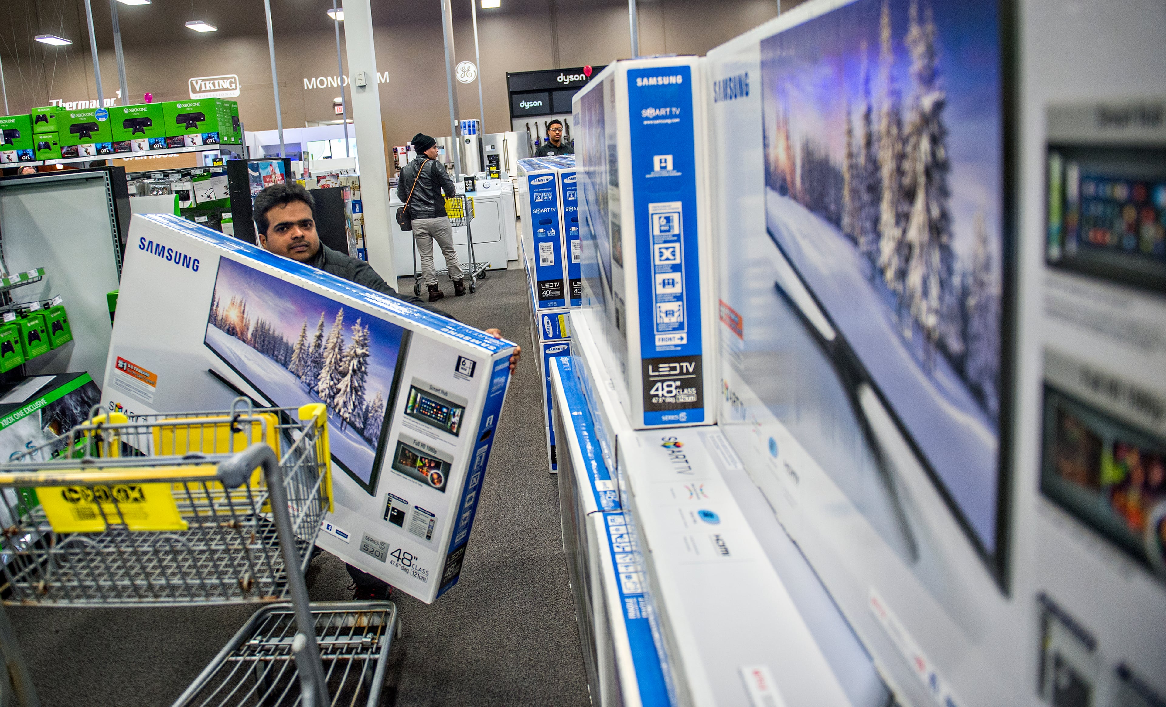 Senthil Nathan loads a television onto his cart inside Best Buy Perimeter in Atlanta during Gray Thursday on Thanksgiving night, Thursday, November 26, 2015. Hundreds of people came out for the start of the biggest shopping weekend of the year. JONATHAN PHILLIPS / SPECIAL