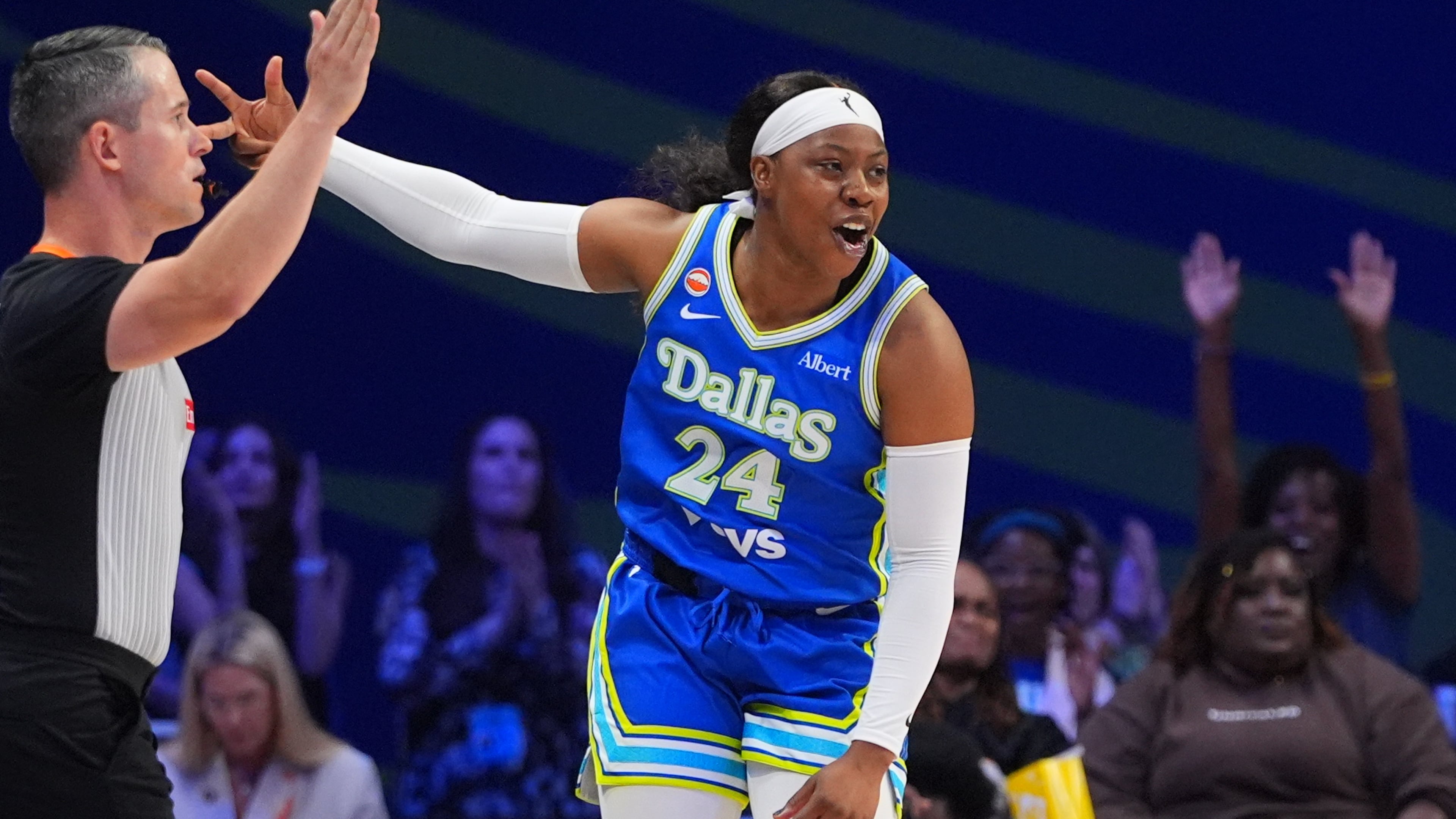 Dallas Wings guard Arike Ogunbowale reacts to scoring a three pointer during the first half of a WNBA basketball game against the Washington Mystics in Arlington, Texas, Monday, May 18, 2026. (AP Photo/LM Otero)