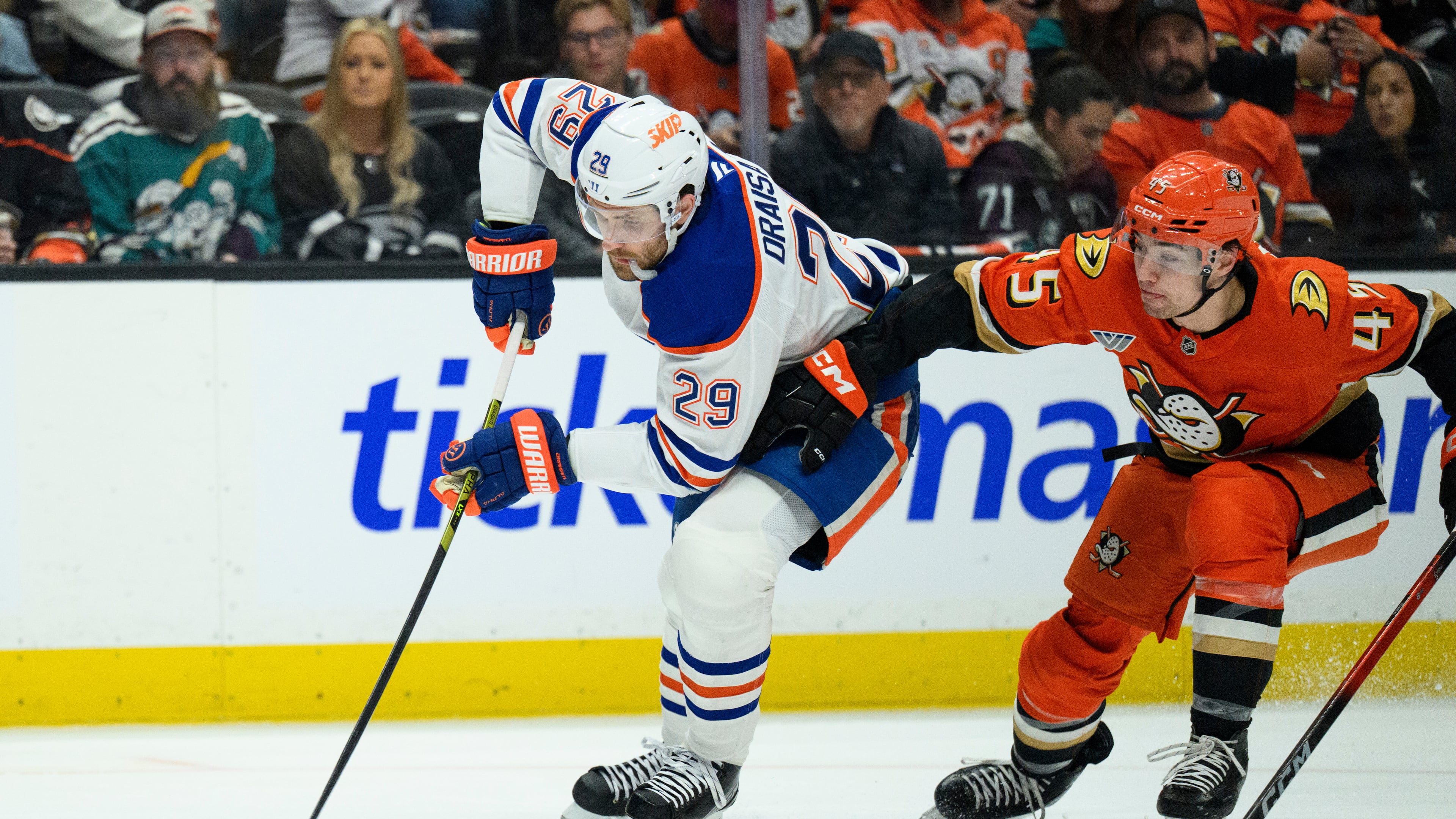 FILE - Edmonton Oilers center Leon Draisaitl, left, controls the puck as Anaheim Ducks right wing Beckett Sennecke defends during the second period of Game 4 in the first round of an NHL hockey Stanley Cup playoff series Sunday, April 26, 2026, in Anaheim, Calif. (AP Photo/Kyusung Gong), File)