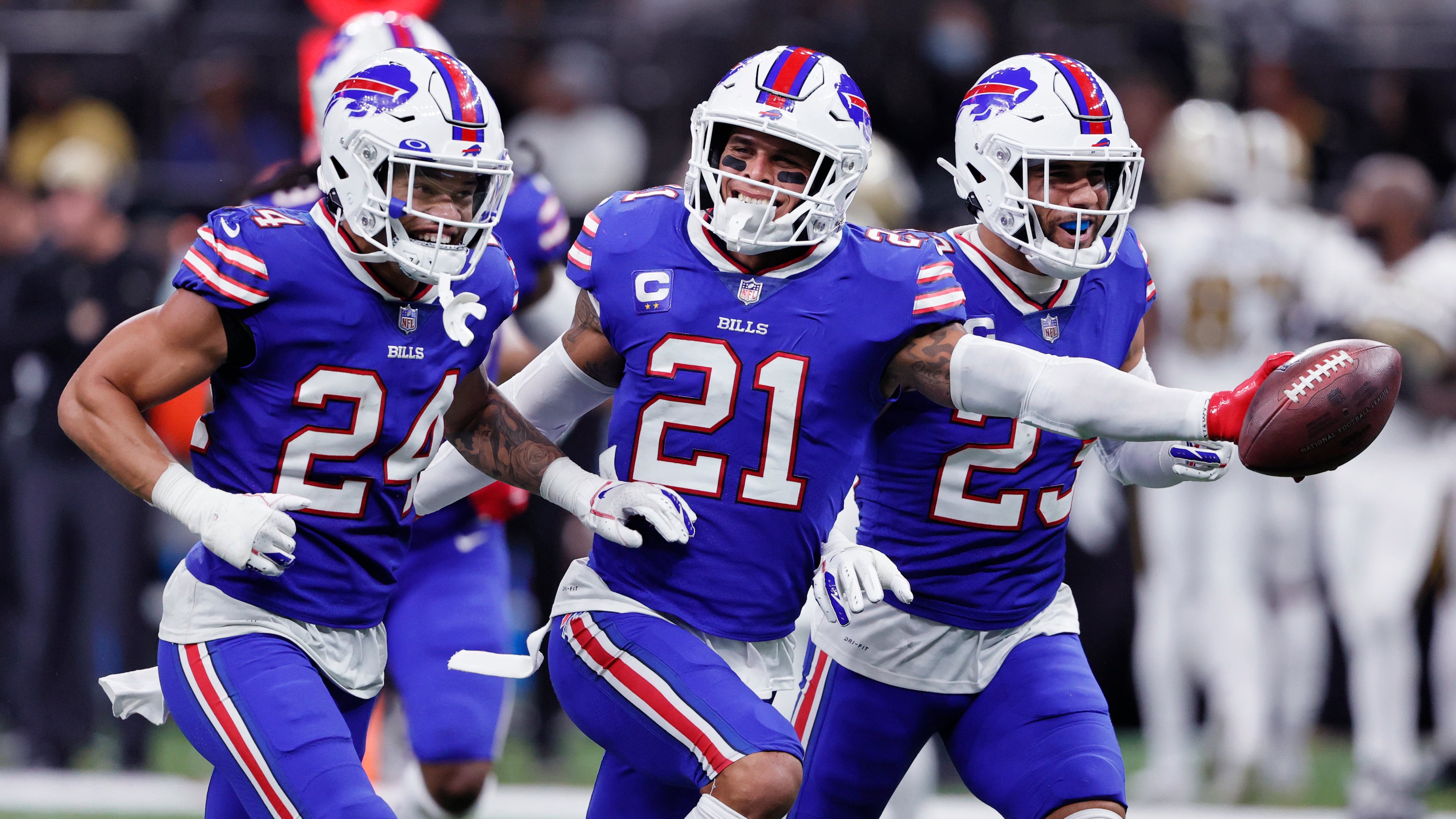 Buffalo Bills free safety Jordan Poyer (21) celebrates his interception with cornerback Taron Johnson (24) and safety Micah Hyde (23) in the second half of an NFL football game in New Orleans, Thursday, Nov. 25, 2021. The Bills won 31-6. (AP Photo/Butch Dill)