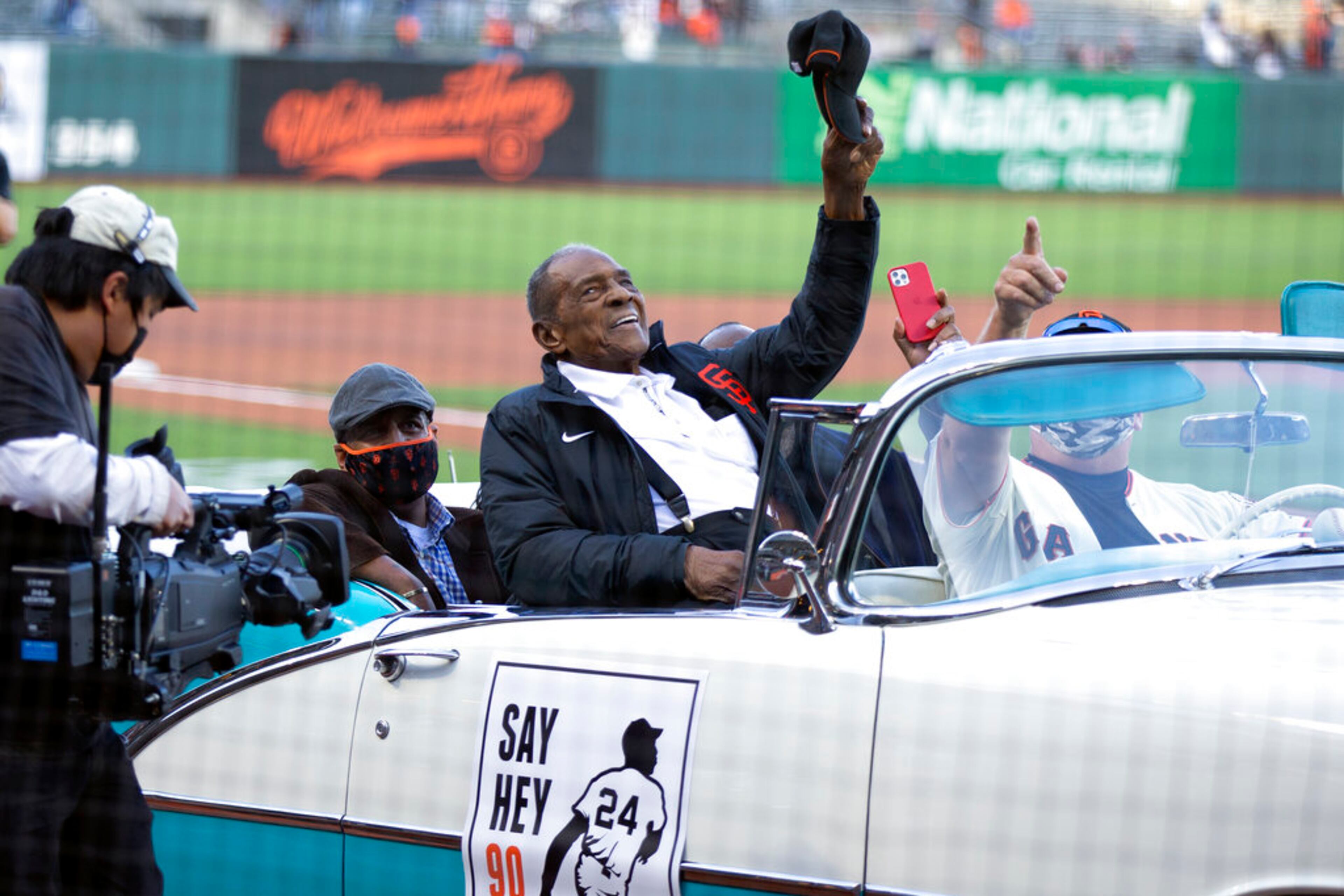 San Francisco Giants Hall of Fame outfielder Willie Mays waves to the crowd, as the team honors him on the day after his 90th birthday, Friday, May 7, 2021, in San Francisco. (AP Photo/D. Ross Cameron)