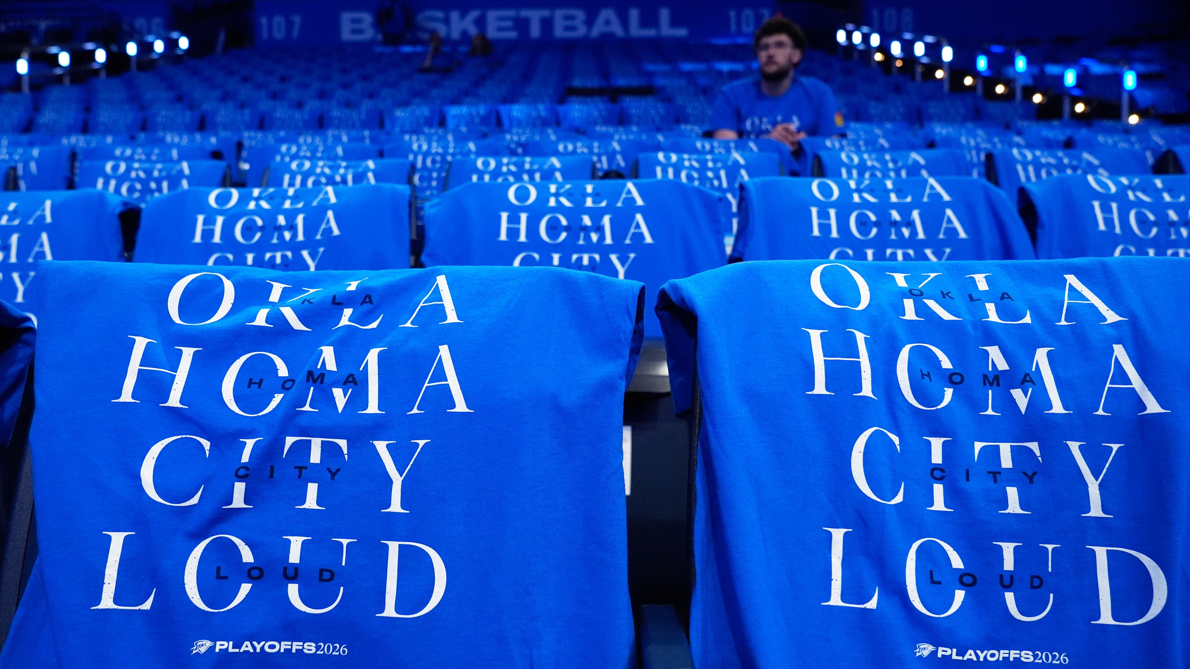 T-shirts are draped on fan seats before Game 1 in a third-round NBA basketball playoffs series between the San Antonio Spurs and the Oklahoma City Thunder Monday, May 18, 2026, in Oklahoma City. (AP Photo/Tony Gutierrez)