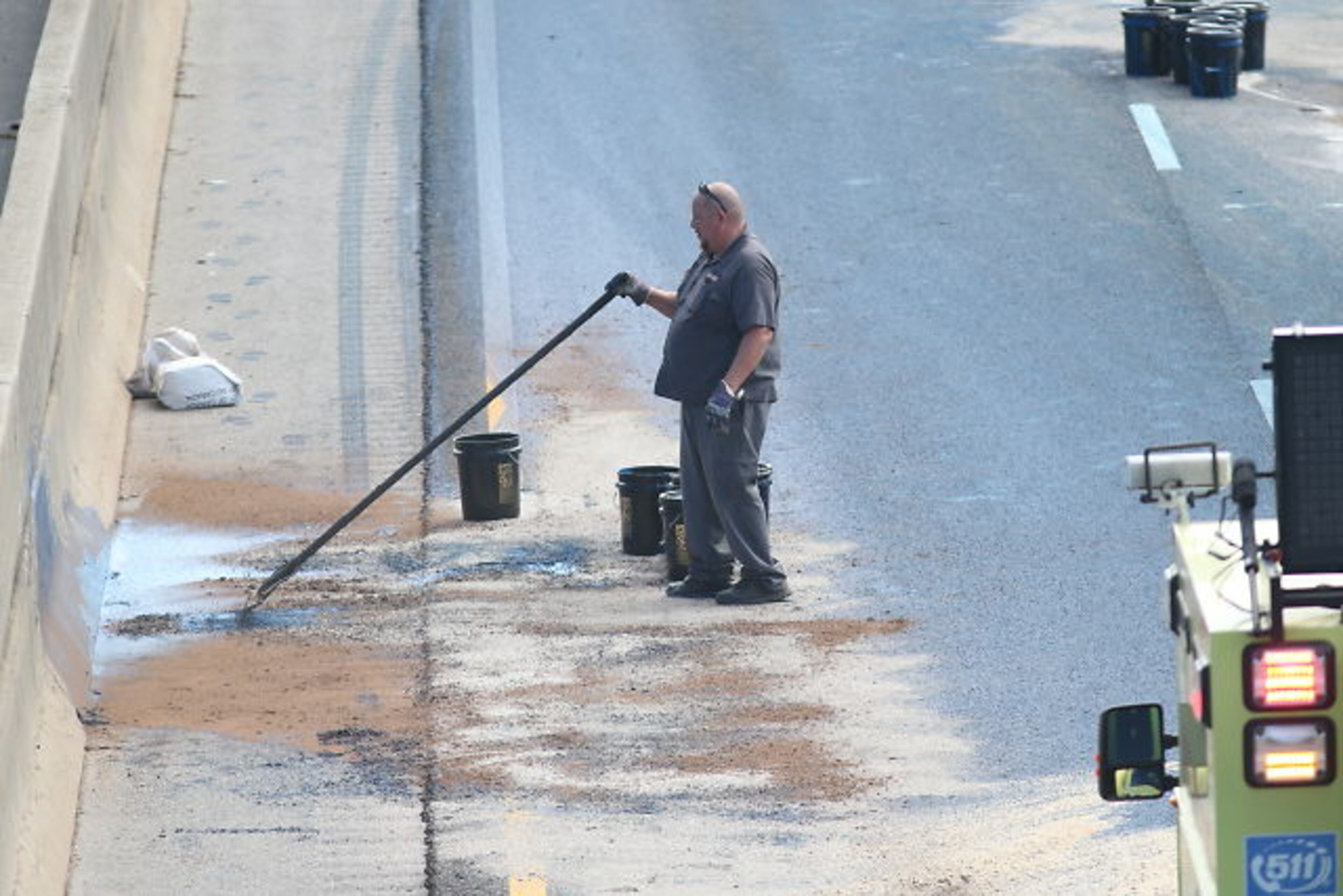 A truck was pulling a trailer loaded with 55-gallon drums of paint when two of the drums fell off near Wesley Chapel Road.
