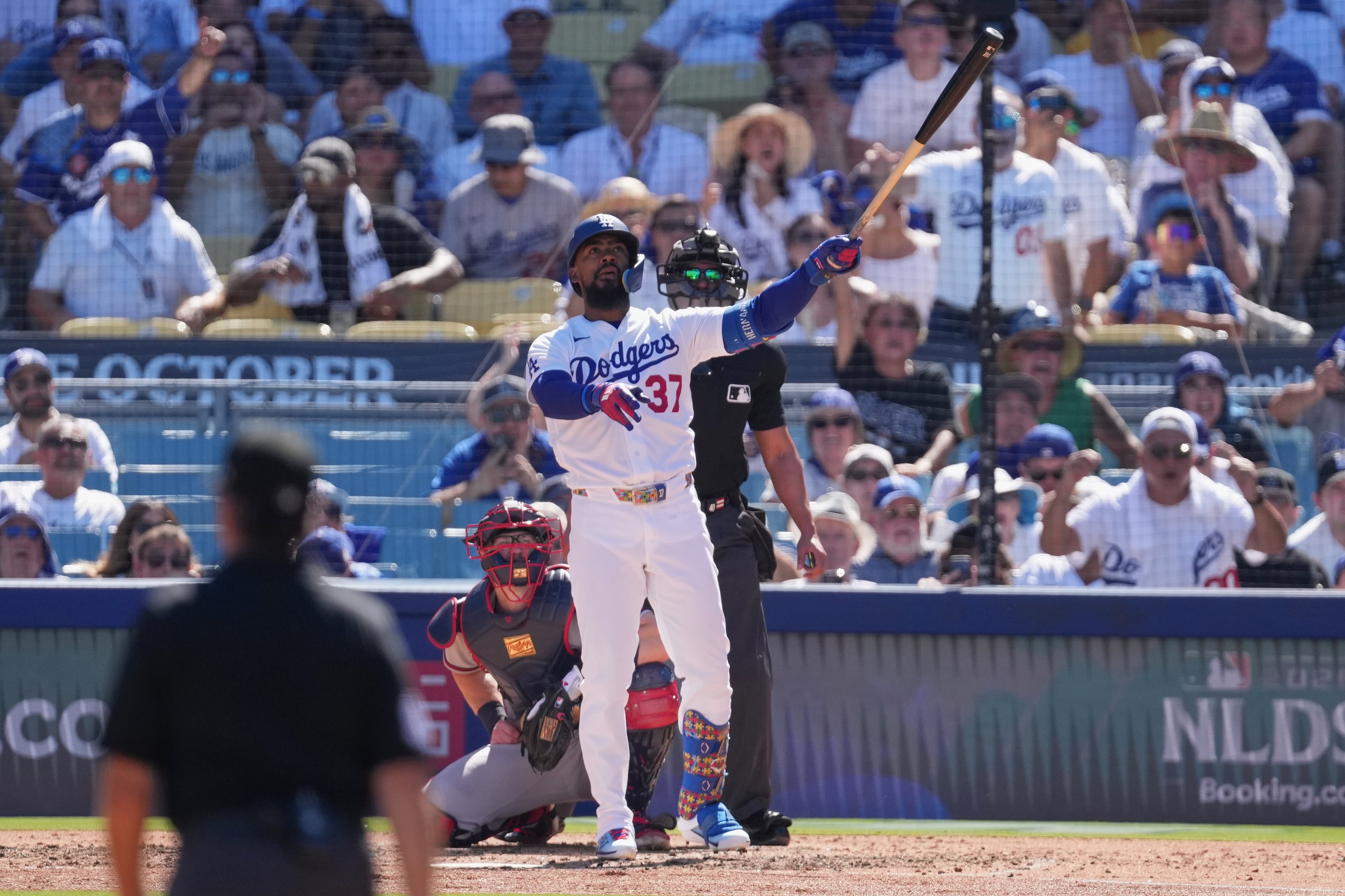 Los Angeles Dodgers' Teoscar Hernández watches his two-run home run during the fourth inning of Game 1 of a National League Division Series baseball game against the Atlanta Braves Saturday, Oct. 3, 2026, in Los Angeles. (Jae C. Hong/AP)