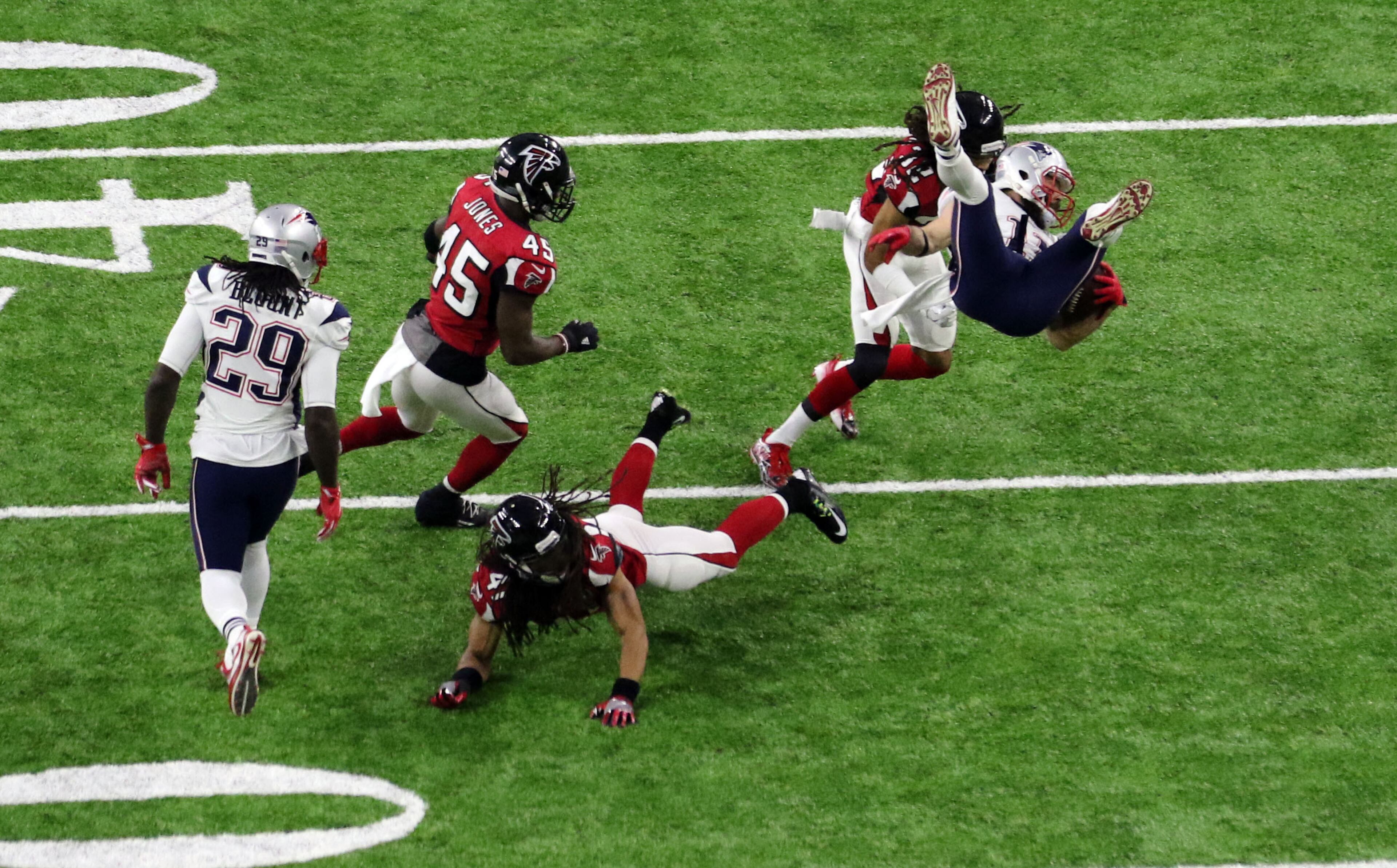 FEBRUARY 5, 2017 HOUSTON TX New England Patriots wide receiver Julian Edelman (11) gets upended as the Atlanta Falcons meet the New England Patriots in Super Bowl LI at NRG Stadium in Houston, TX, Sunday, February 5, 2017. John Spink/AJC