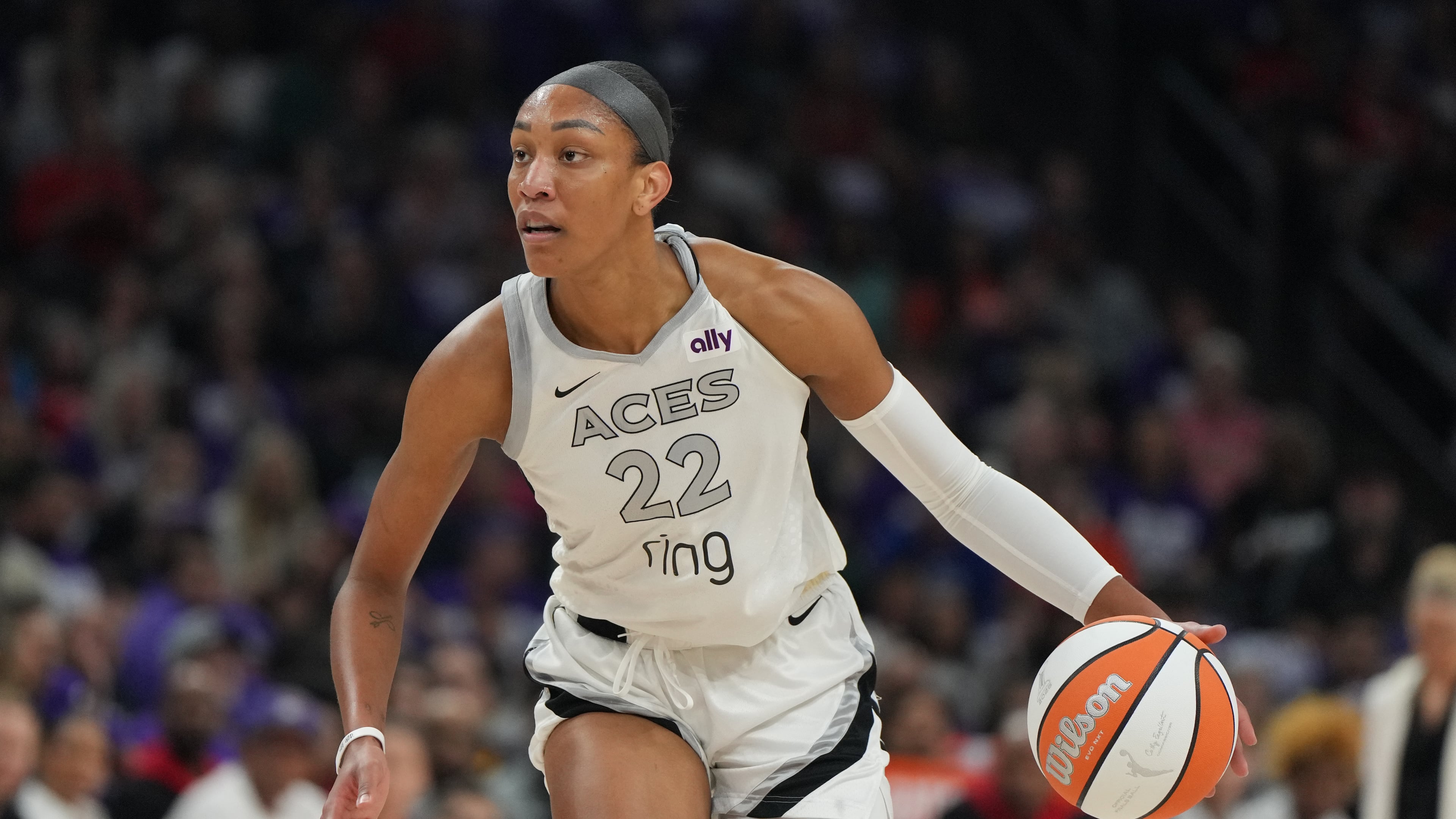 FILE - Las Vegas Aces center A'ja Wilson (22) dribbles against the Phoenix Mercury during the first half of Game 4 of the WNBA basketball finals, Friday, Oct. 10, 2025, in Phoenix. (AP Photo/Rick Scuteri, File)