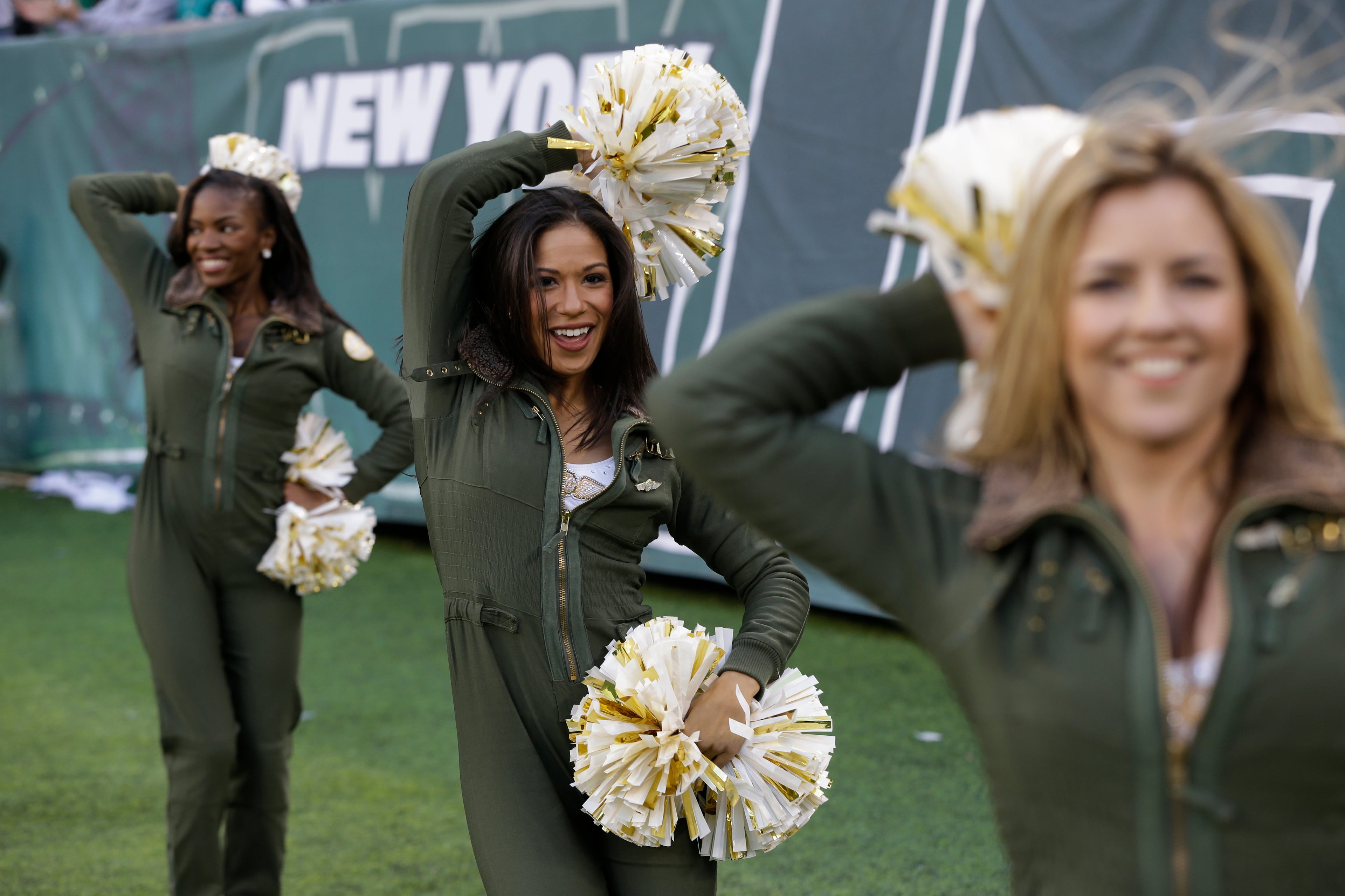 New York Jets cheerleaders perform during the second half of an NFL football game between the New York Jets and the Miami Dolphins on Dec. 1, 2013, in East Rutherford, N.J.