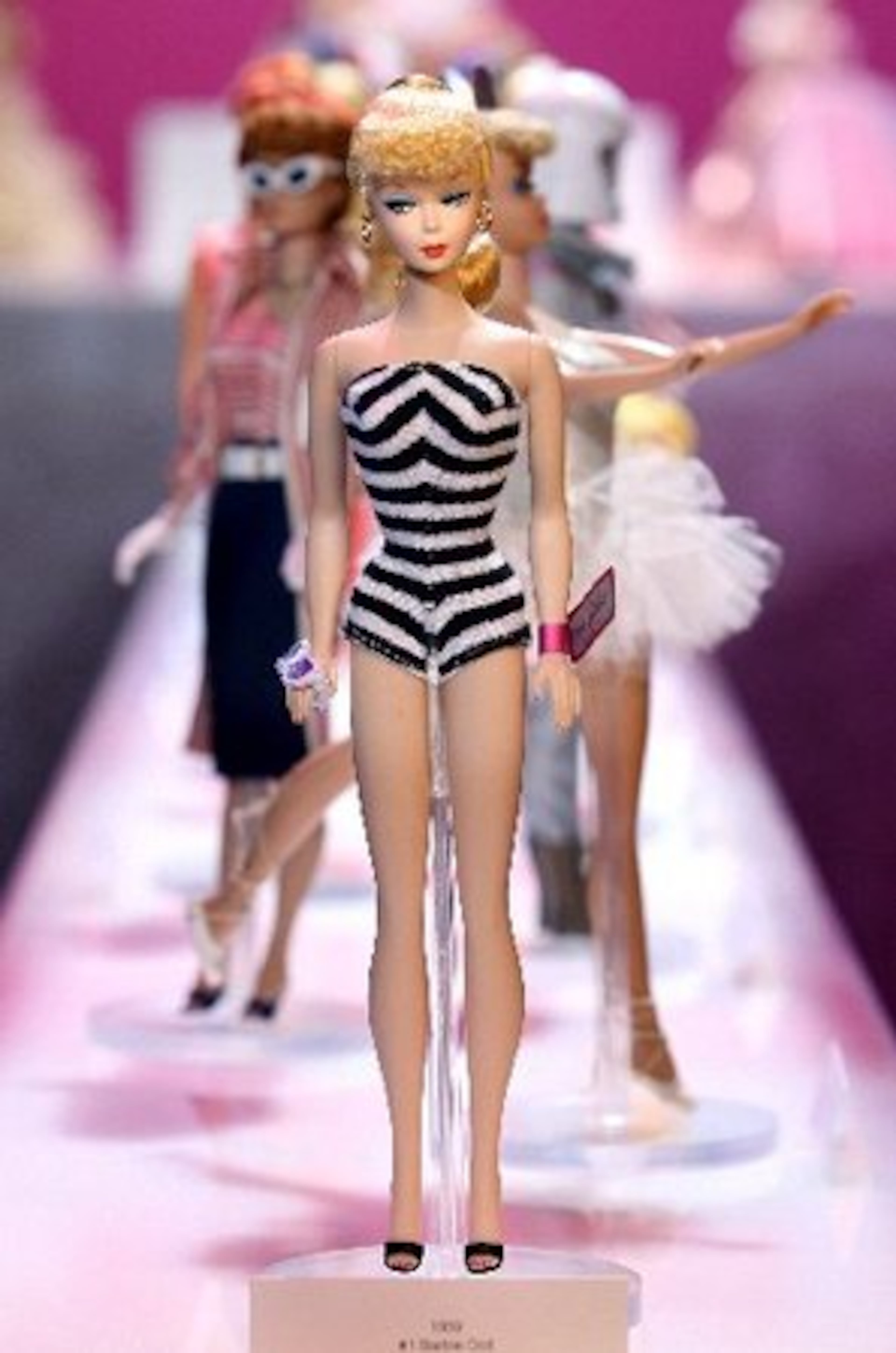 The 50th anniversary of the Barbie doll was commemorated with a lineup of dolls by Mattel in New York during Toy Fair 2009 last month. First in line is the first Barbie in her original black and white swim suit.
