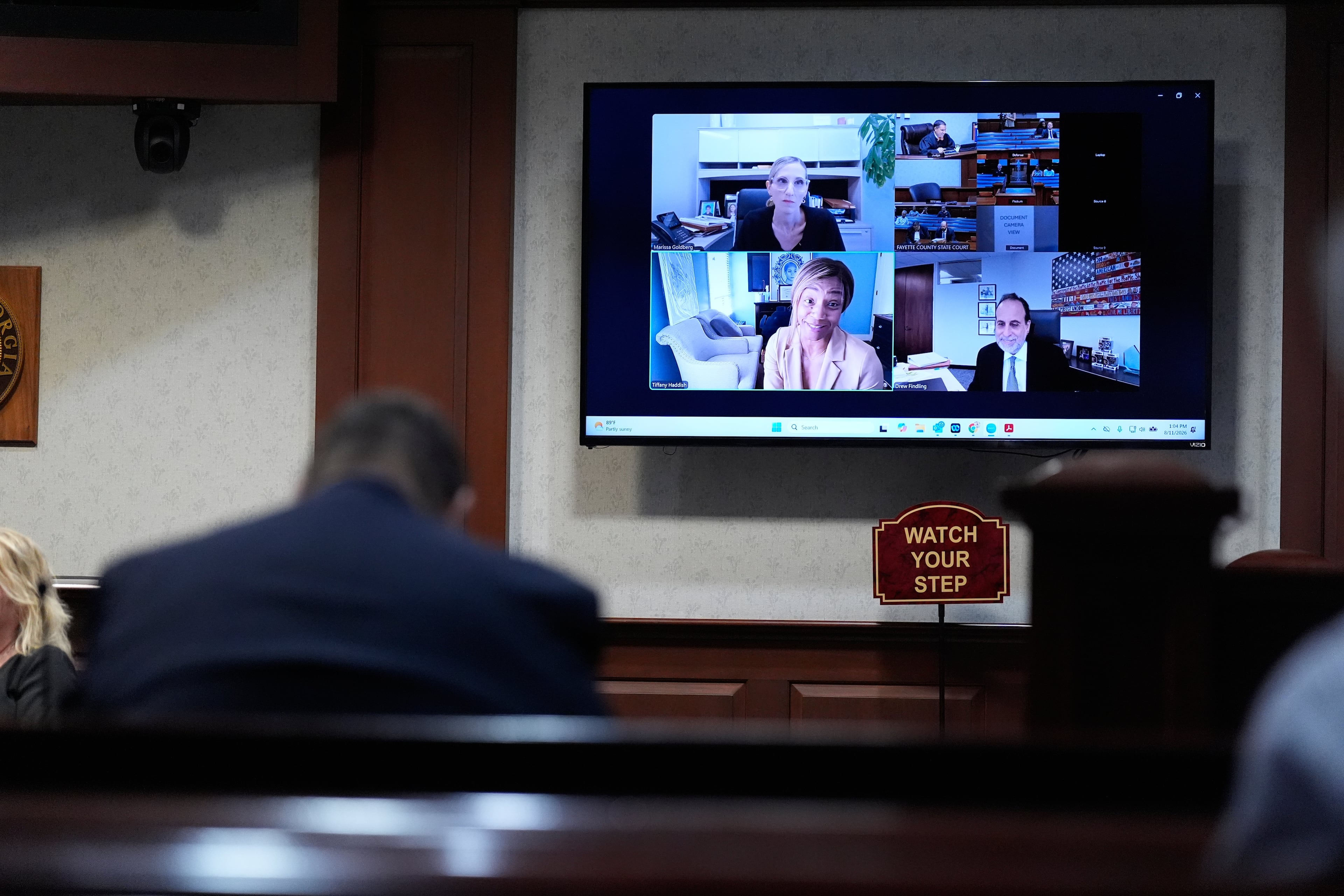 Comedian and actor Tiffany Haddish (bottom left of screen), along with her attorneys, makes a court appearance via Zoom Tuesday, Aug. 11, 2026, in Fayetteville, Ga. (Brynn Anderson/AP)