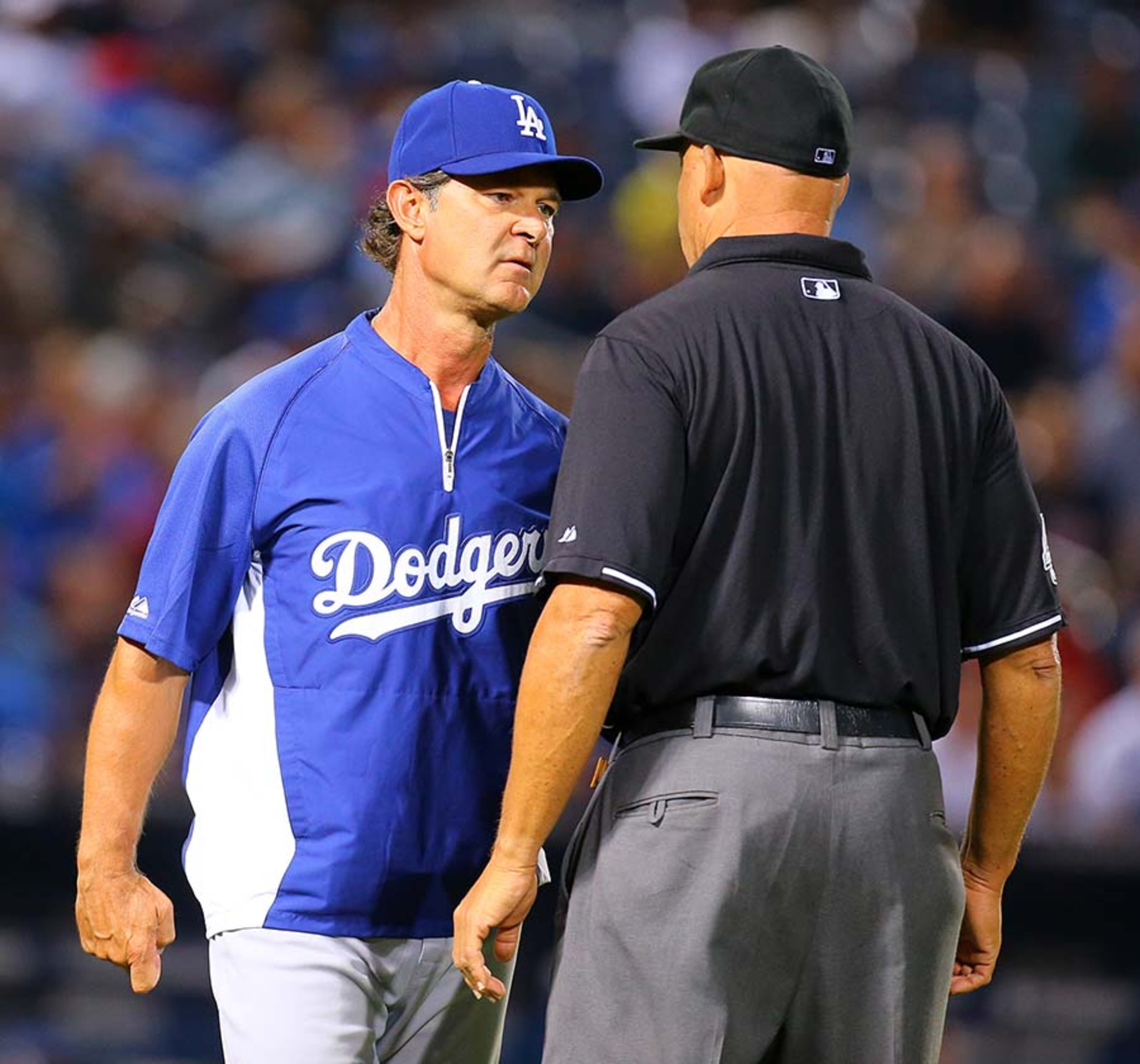 Dodgers manager Don Mattingly argues a call by first base umpire Kerwin Danley on a bunt by Braves B.J. Upton during the fifth inning Monday at Turner Field in Atlanta.