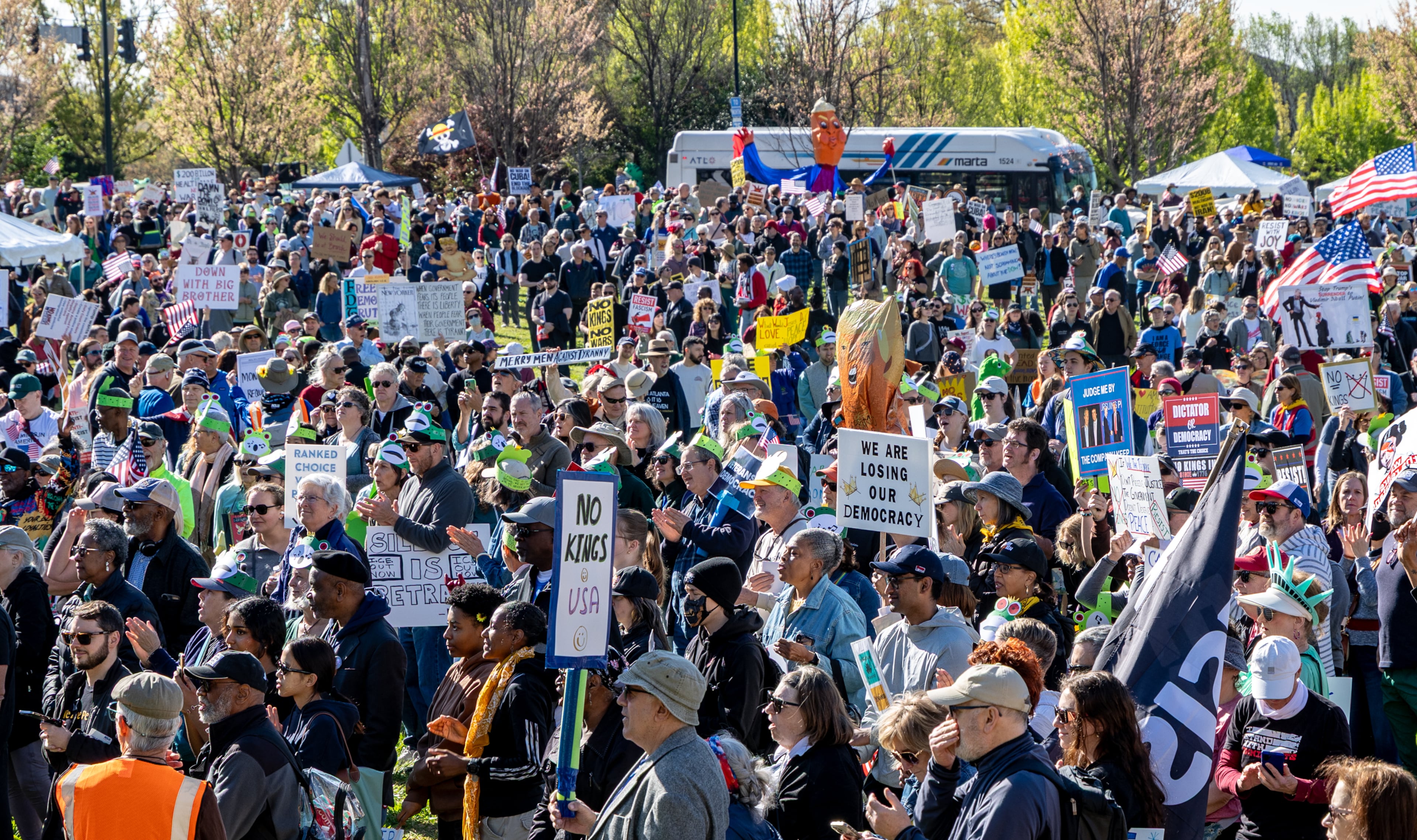 Demonstrators gather to march toward the state Capitol during the No Kings protest on Saturday, March 28, 2026, in Atlanta. (Jenni Girtman for the AJC)