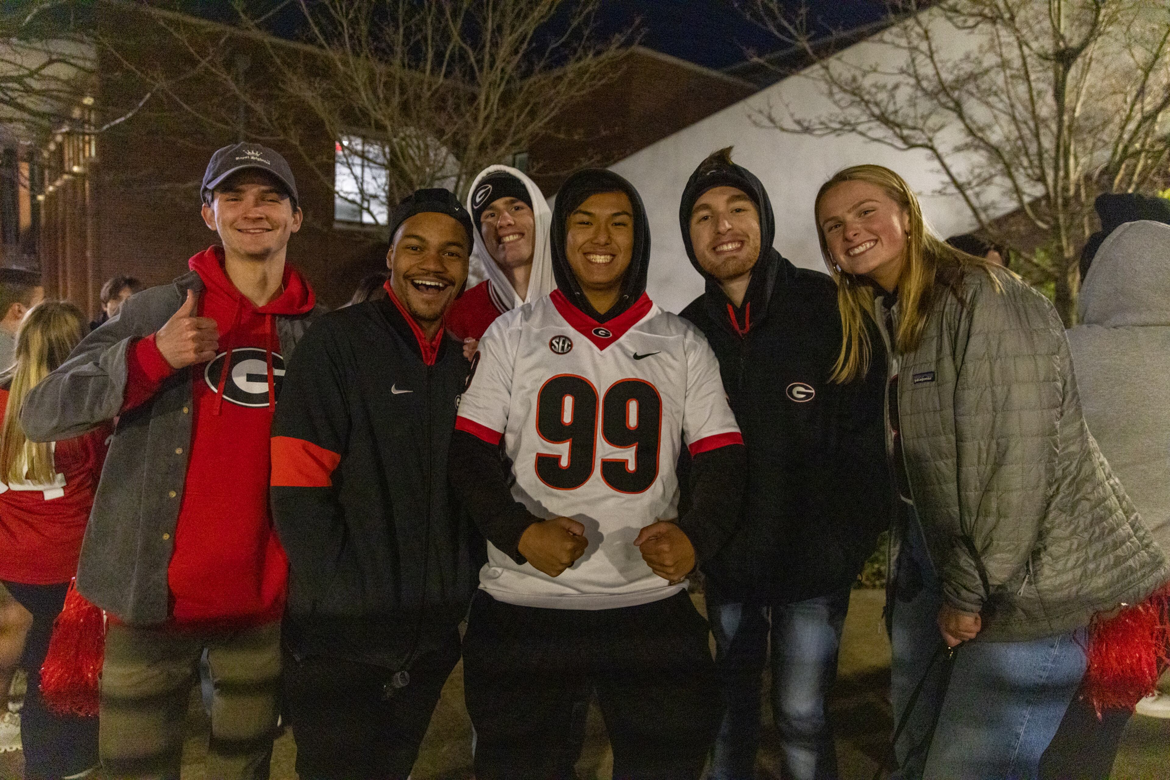 Georgia Bulldogs fans pose for photos as they wait to enter Stegeman Coliseum in Athens ahead of a watch party for the College Football Playoff national championship game on Monday, January 10, 2022. (Photo: Nathan Posner for The Atlanta Journal-Constitution)