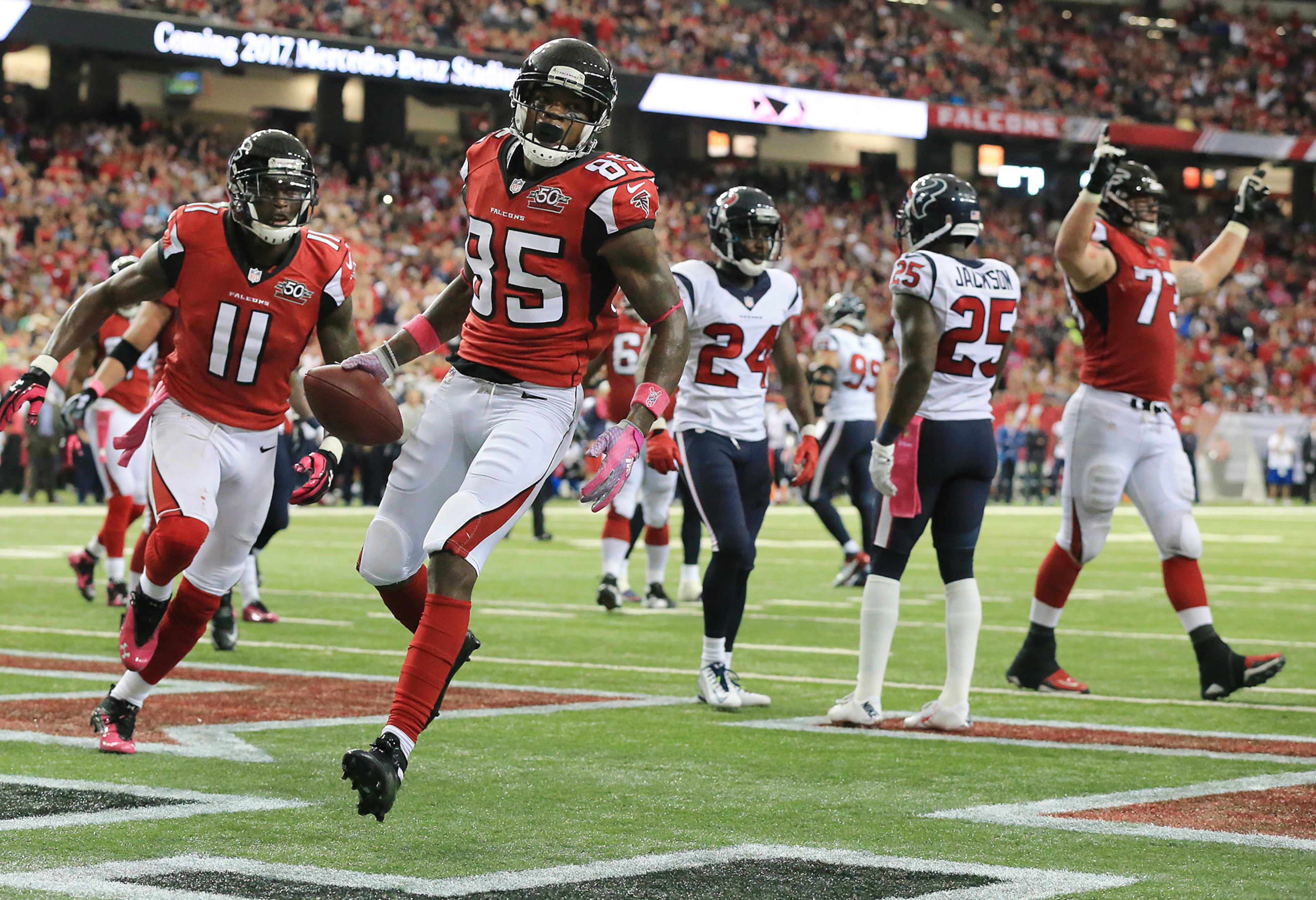 Falcons wide receiver Leonard Hankerson makes the reception in the endzone past Texan defenders for the touchdown and a 28-0 lead during the second quarter in a football game on Sunday, Oct. 4, 2015, in Atlanta.