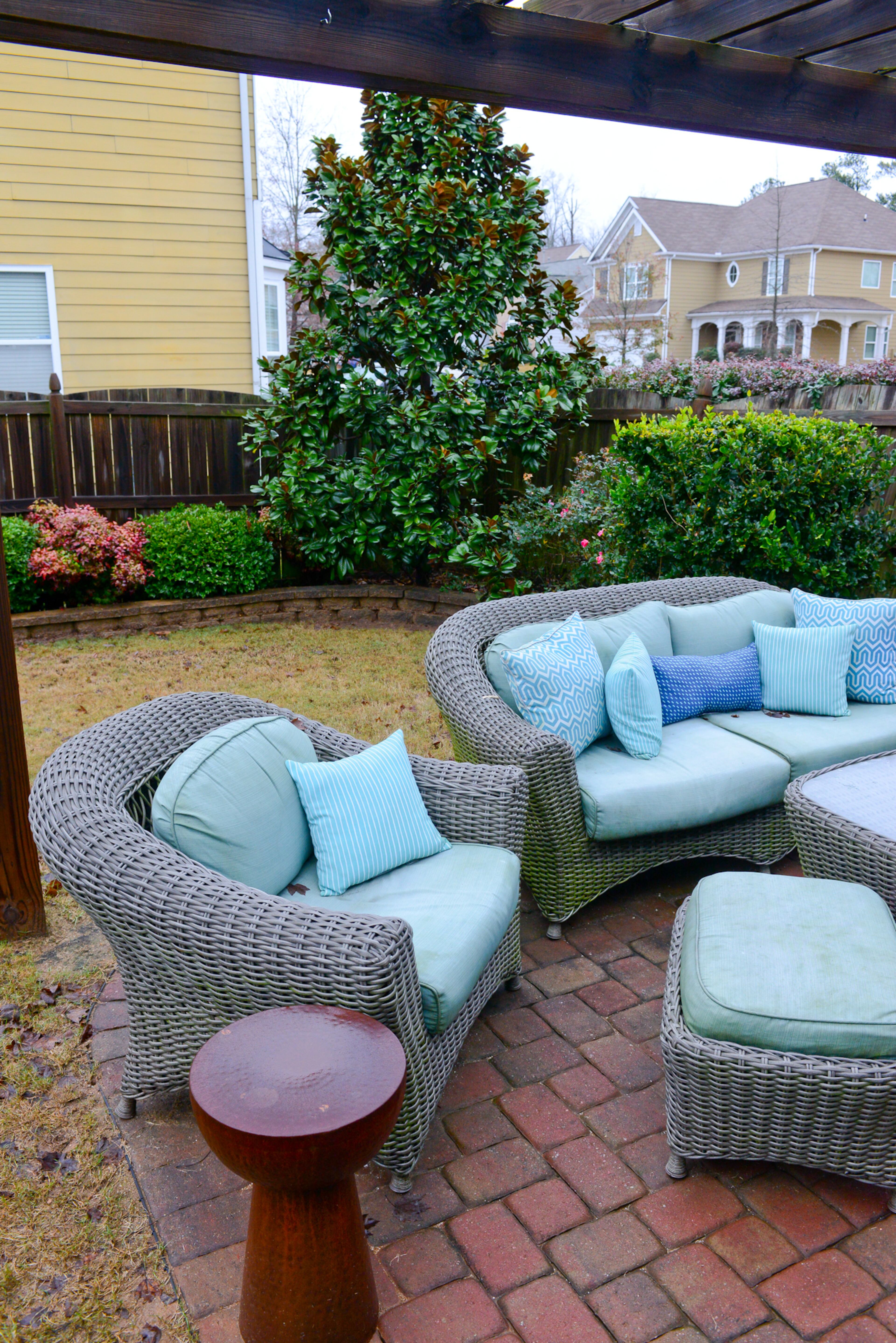 Outside, homeowners Travis Snyder and Craig Cowan have added new landscaping, including a patio and pergola. Outdoor furniture from Home Depot extends the homeowners' living and entertaining space to the patio.