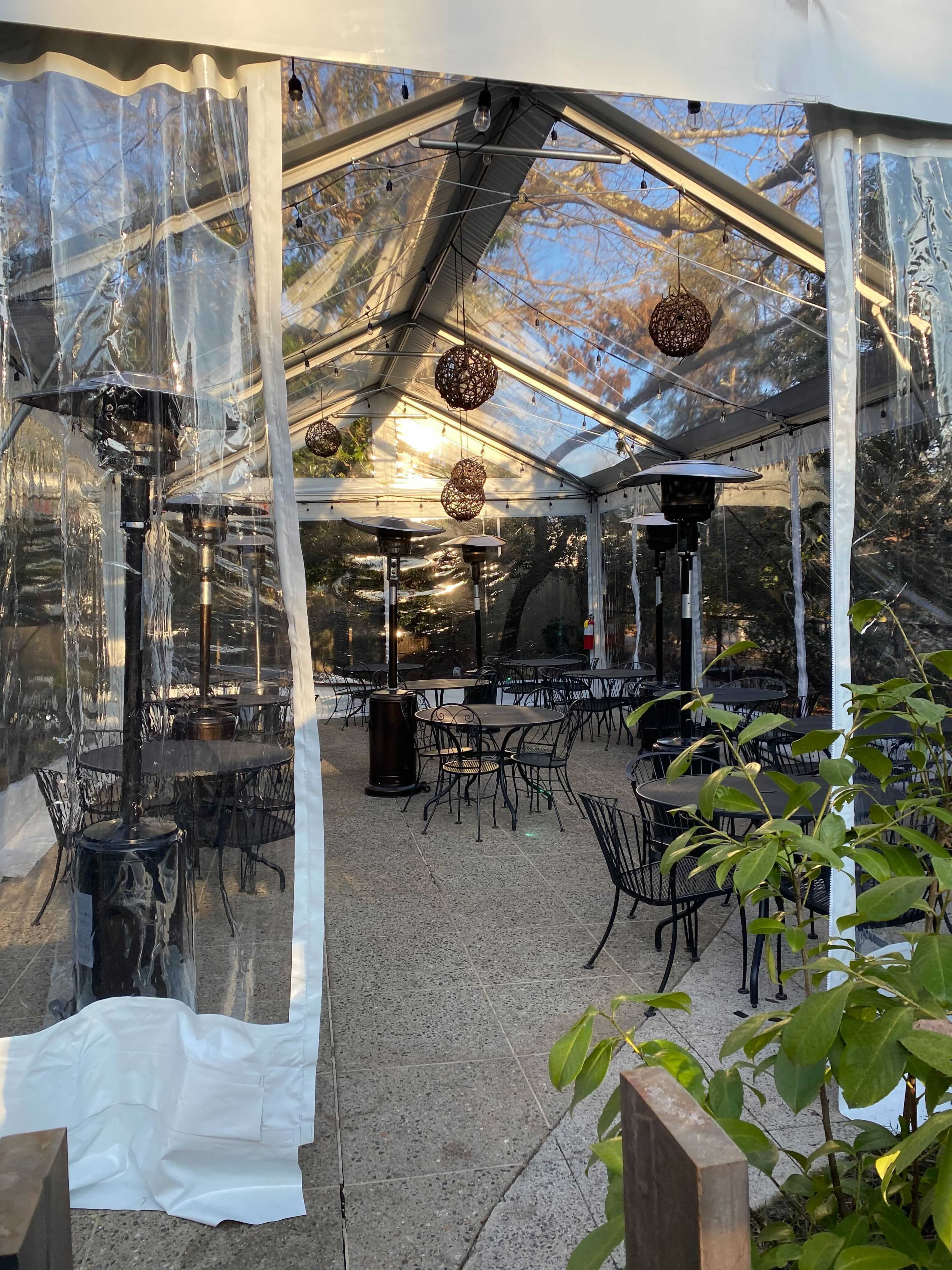 One section of the Chastain's large patio is tented and heated. Ligaya Figueras/ligaya.figueras@ajc.com