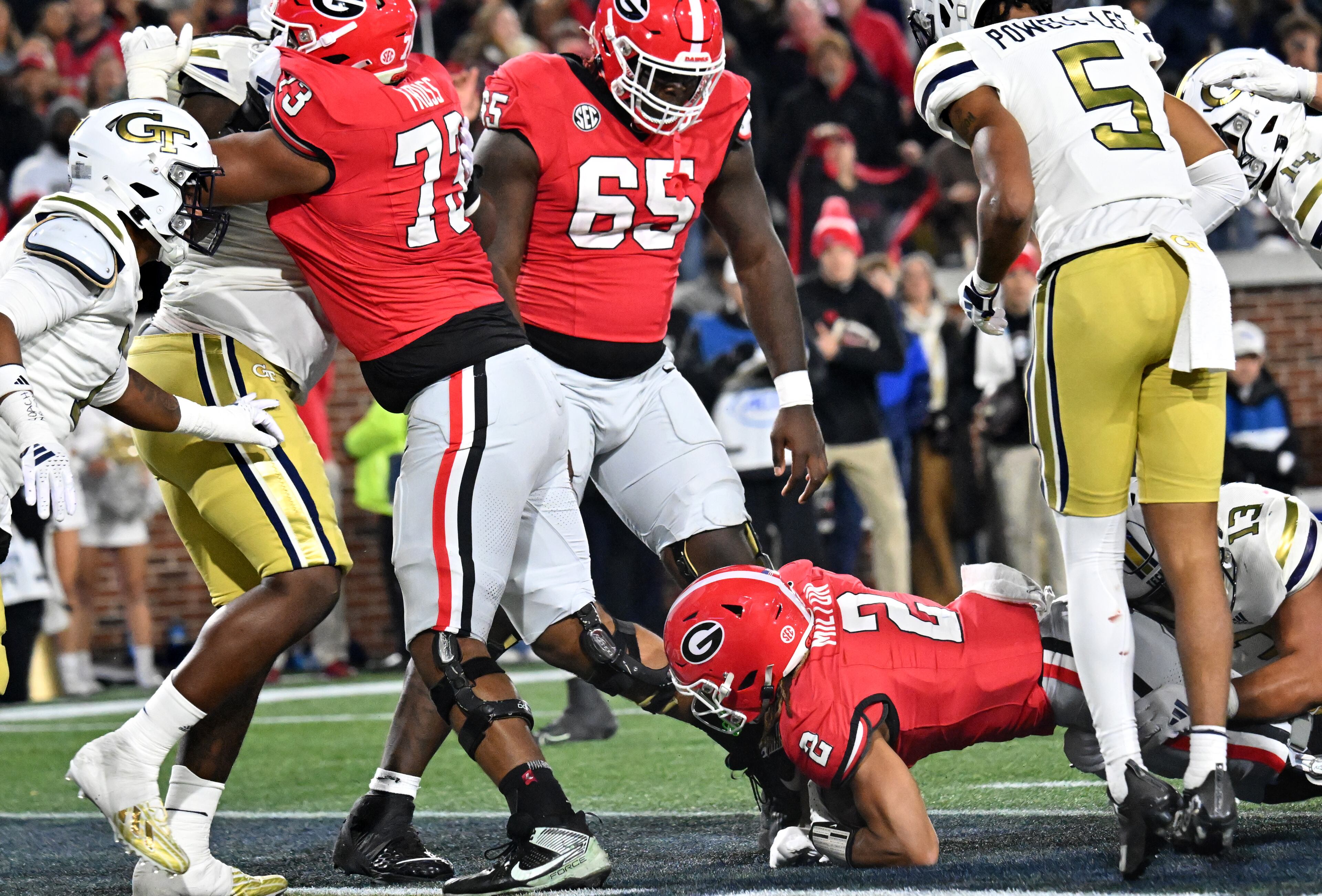 Georgia running back Kendall Milton (2) scores a touchdown during the first half of an NCAA college football game at Georgia Tech's Bobby Dodd Stadium, Saturday, November 25, 2023, in Atlanta. (Hyosub Shin / Hyosub.Shin@ajc.com)