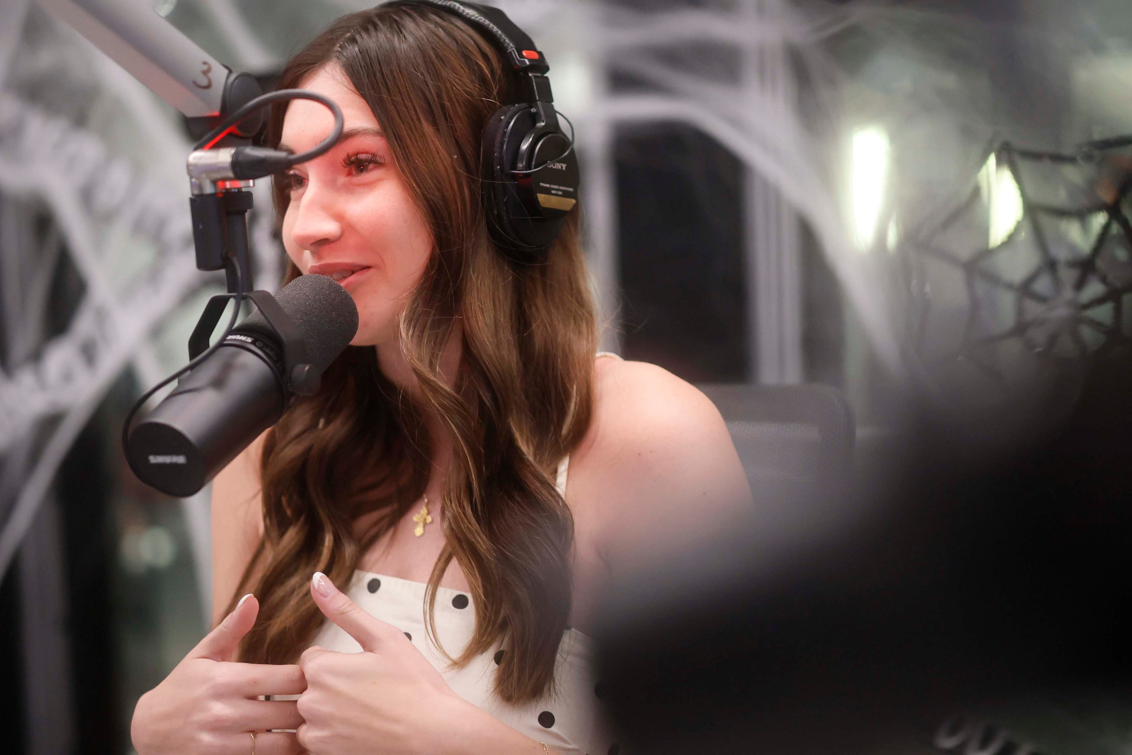 Anna “AB” Bohlmann speaks to listeners during “The Bret Mega Morning Show” on Tuesday, Oct. 20, 2026. Bohlmann moved from St. Louis to co-host the show. (Miguel Martinez/AJC)